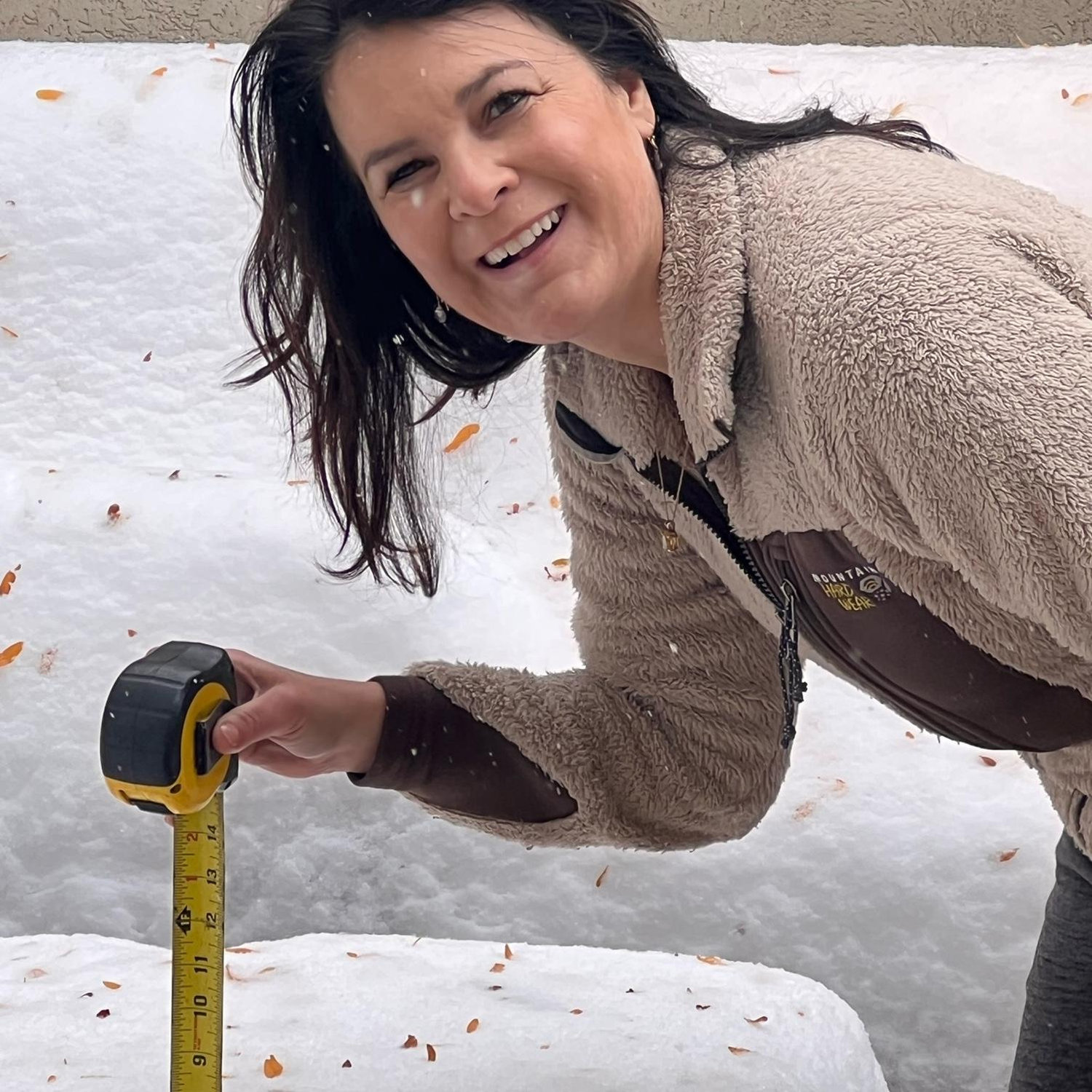 Kim sending her mom exact measurements of snowfall.
