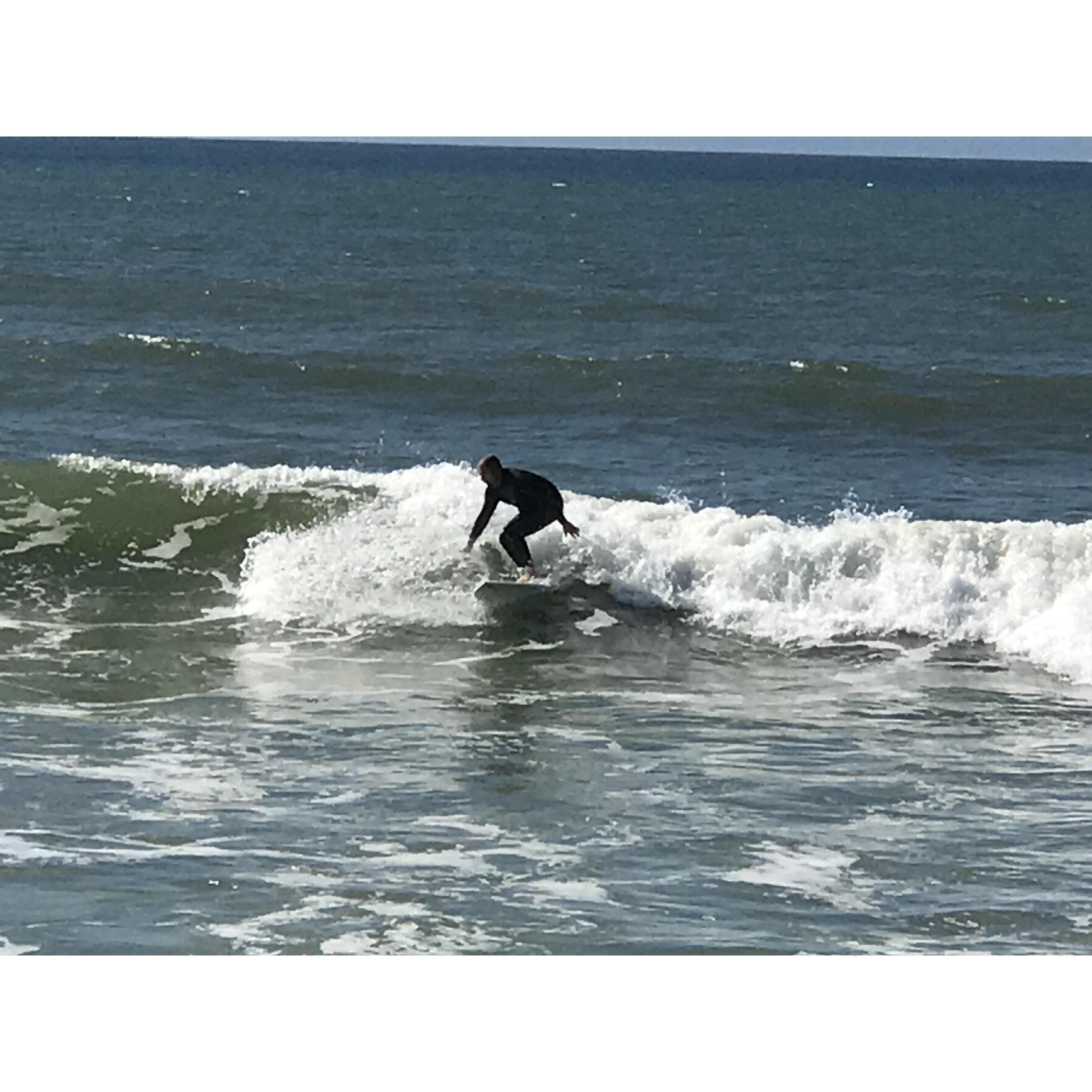 Enjoying some R&R on the beach while watching my handsome surfer!