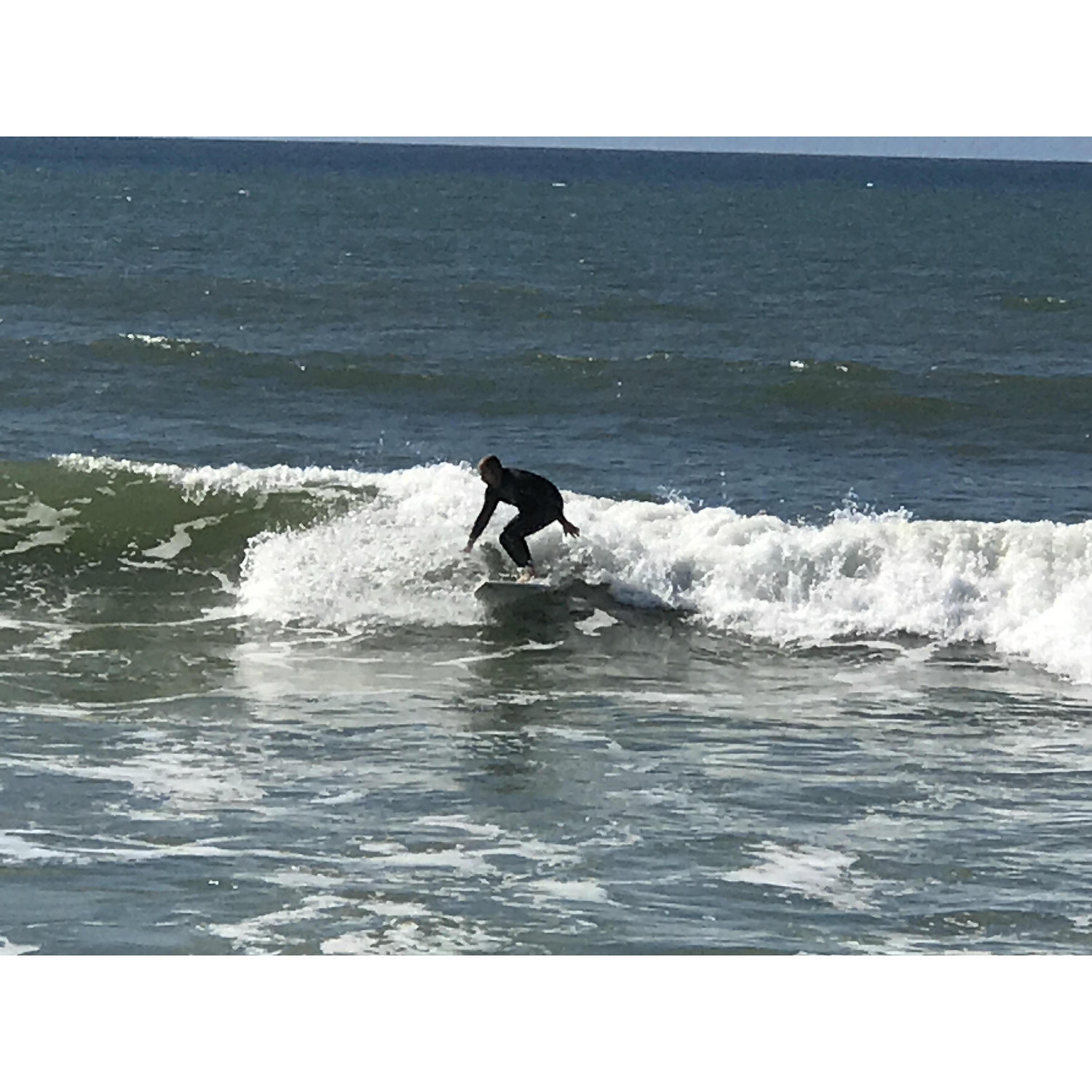 Enjoying some R&R on the beach while watching my handsome surfer!