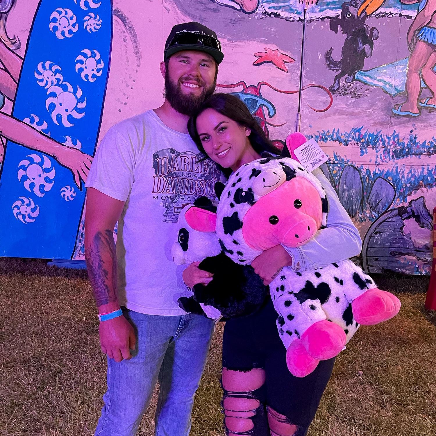 Fun fact, Jarod threw his shoulder out winning Kristy these prizes