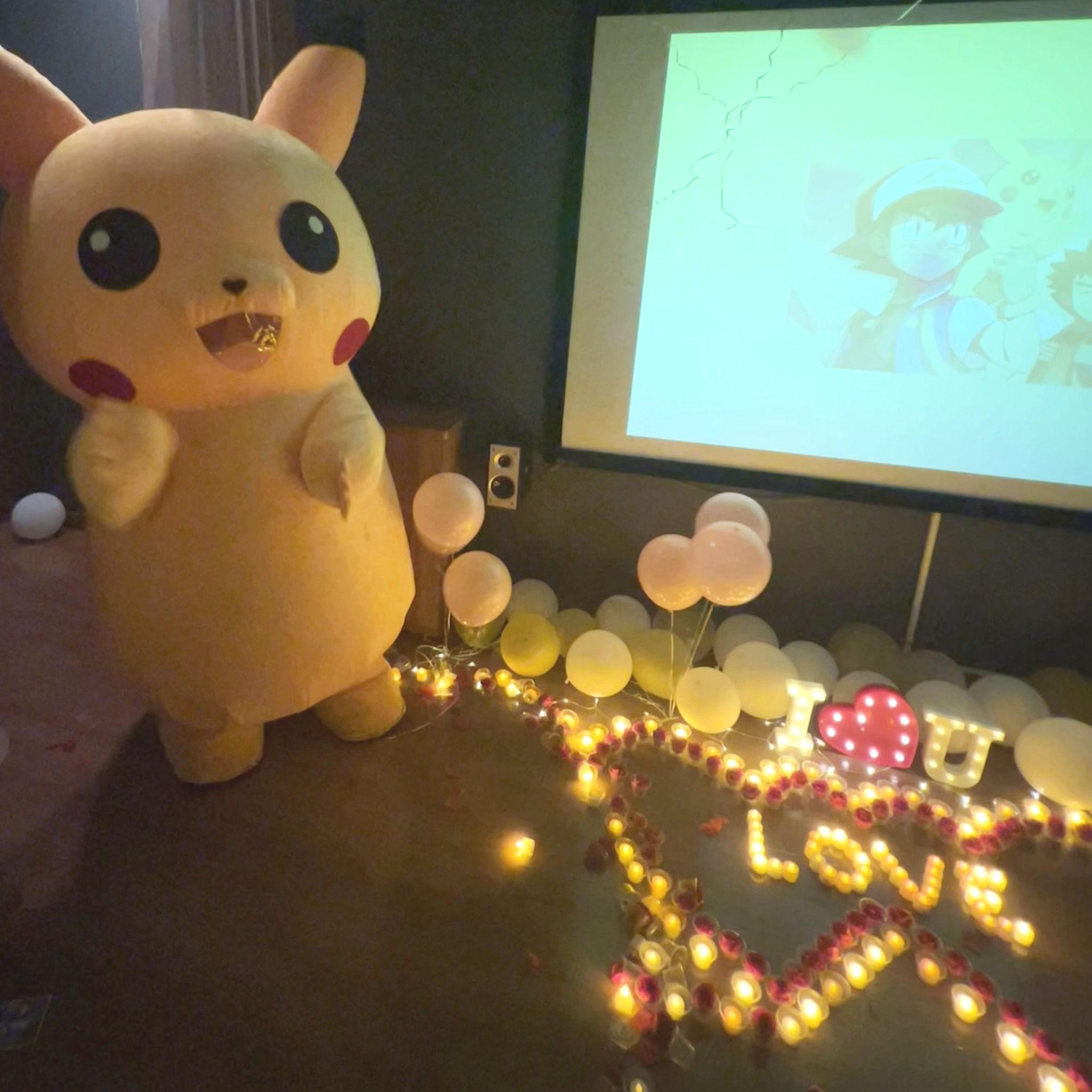 (19) The barista presented Tho with his first puzzle to solve. Just as Tho cracked the final code, the door swung open to reveal... a giant, inflatable Pikachu.