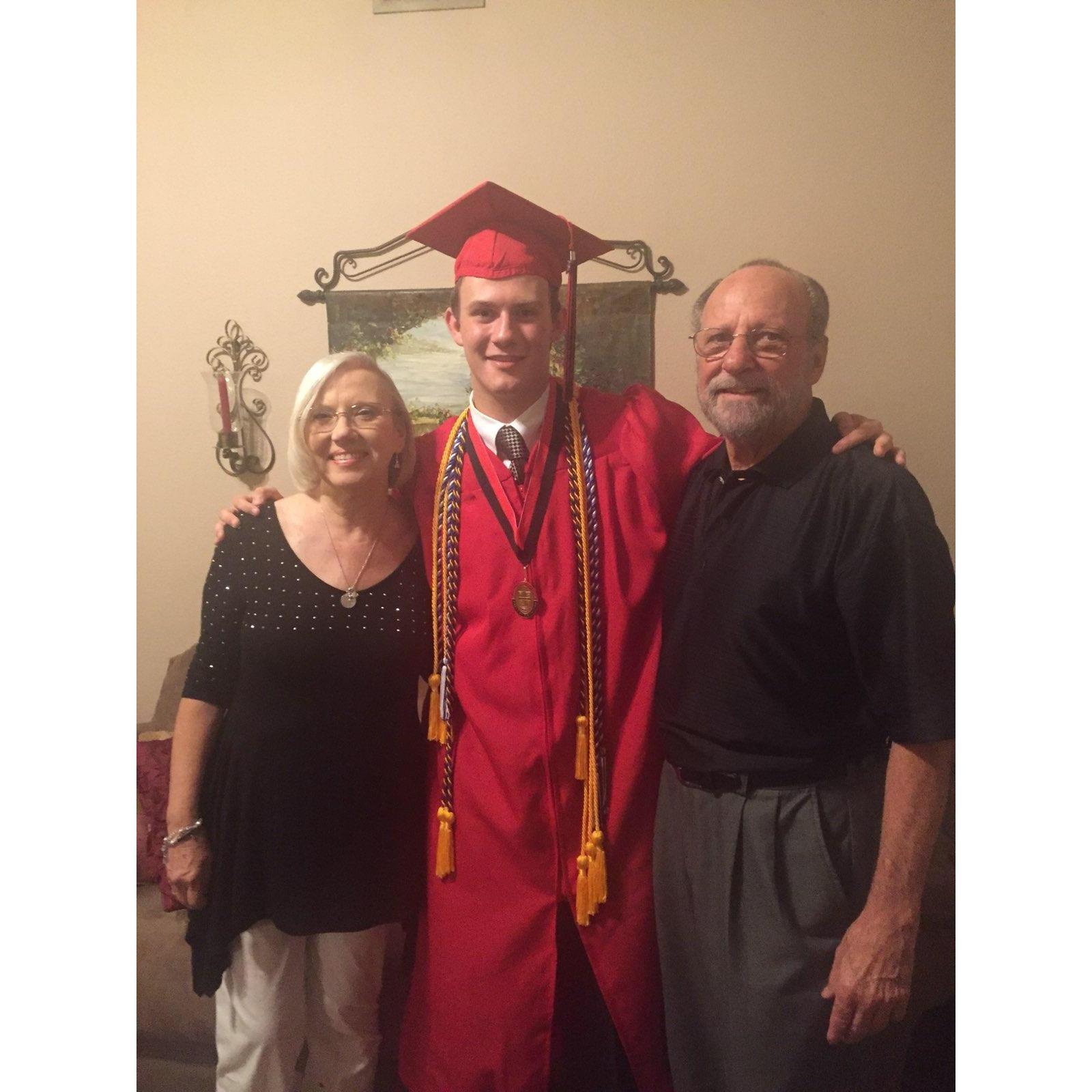 Quinton and his grandparents at his High School graduation (2015)