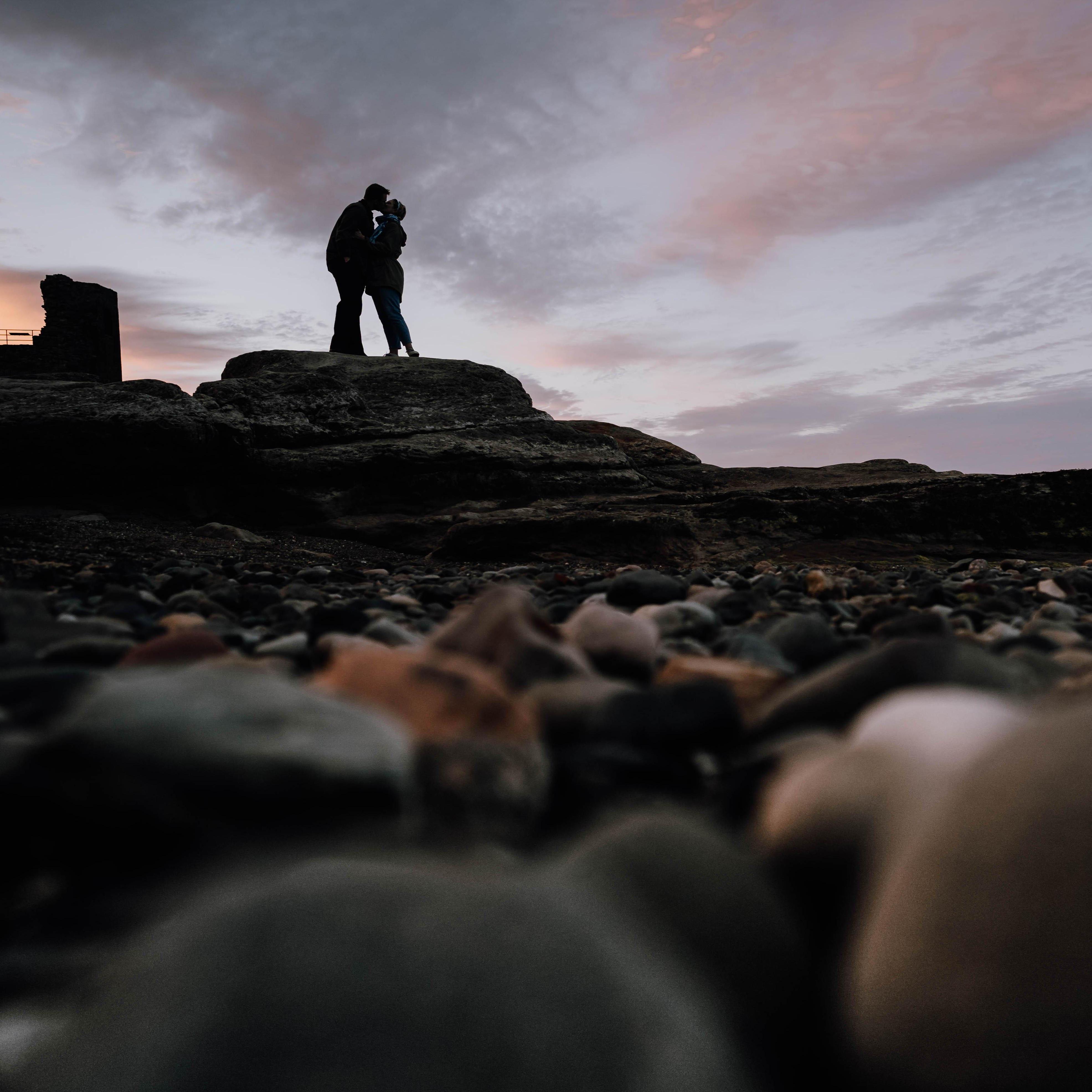 POV: You have moved from the bushes to amongst the rocks on Castle Sands. You are witnessing a not-so-natural albeit adorable staged kiss.
