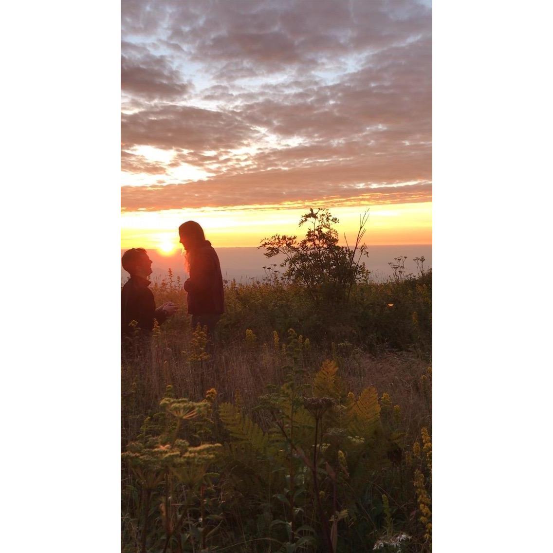 A snapshot from the video of Mason's proposal at sunrise outside Asheville, NC!