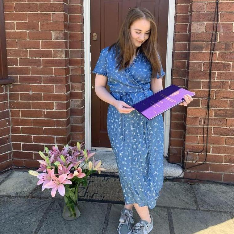 May 2020 - Dissertation submitted! With flowers outside our lockdown lodge (James' Parents House)