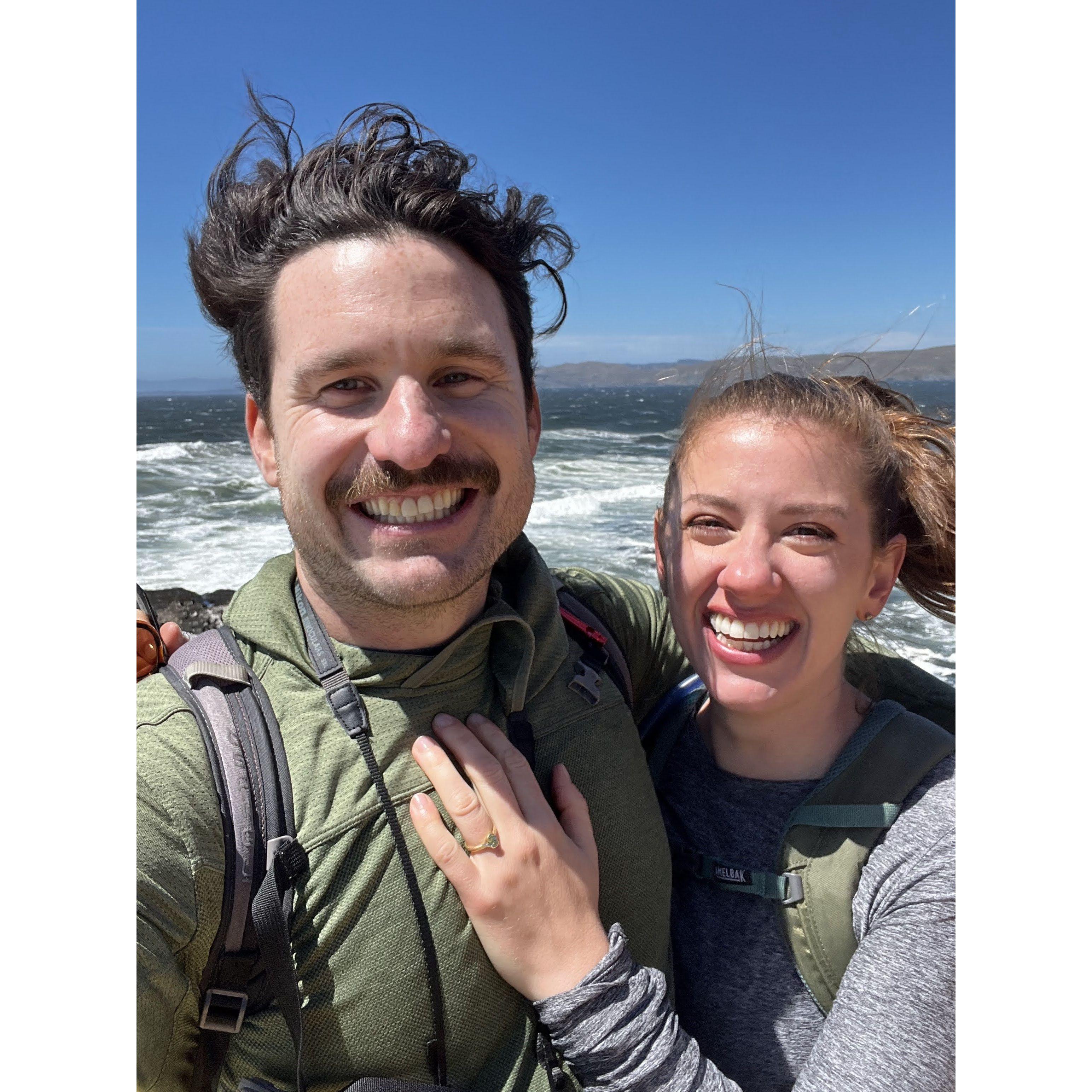 Seconds after Tommy proposed to Ava at the tip of Tomales Point, near Bodega Bay, CA. 10-mile roundtrip hike among wildflowers and breathtaking views - everything they love. June 2024.