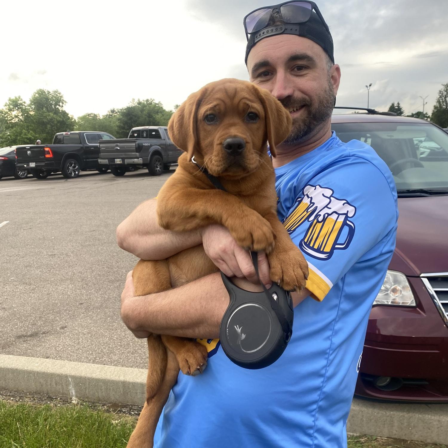 Baby Lady watching her dad play softball