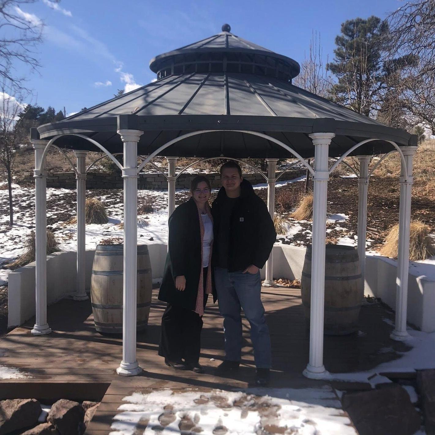 Us at our wedding venue the day we booked it right after getting engaged!