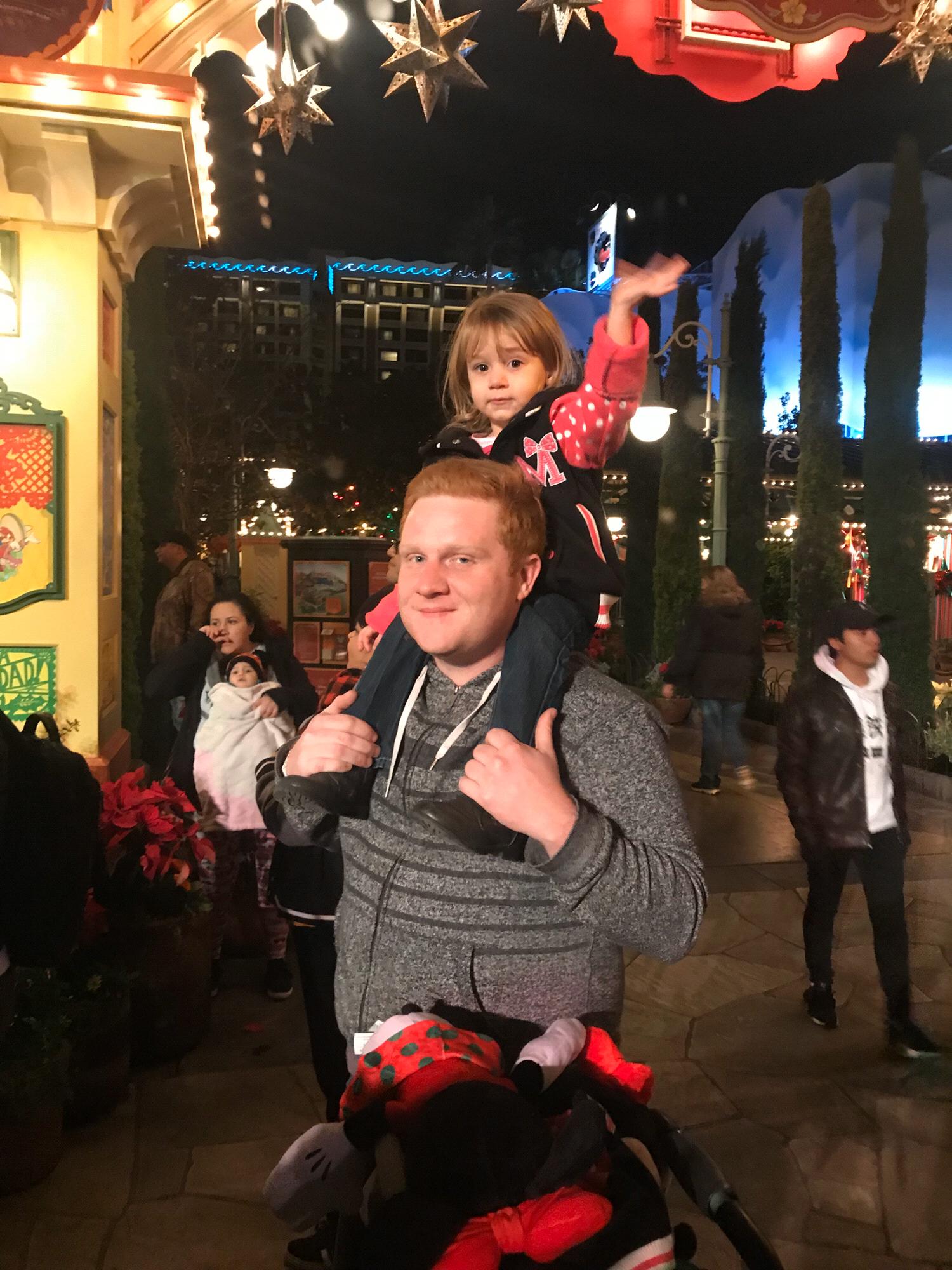 Uncle Jared helping little Zelda see the parade!