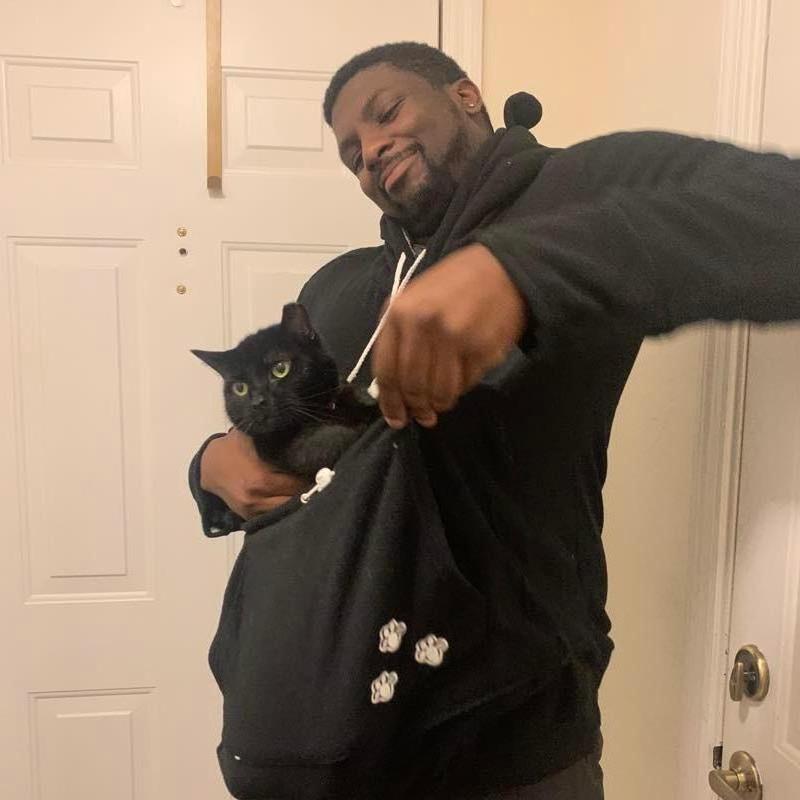 Alex and his cat, Osiris. Alex got a hoodie with a pocket for Osiris. Osiris clearly wasn't into it.