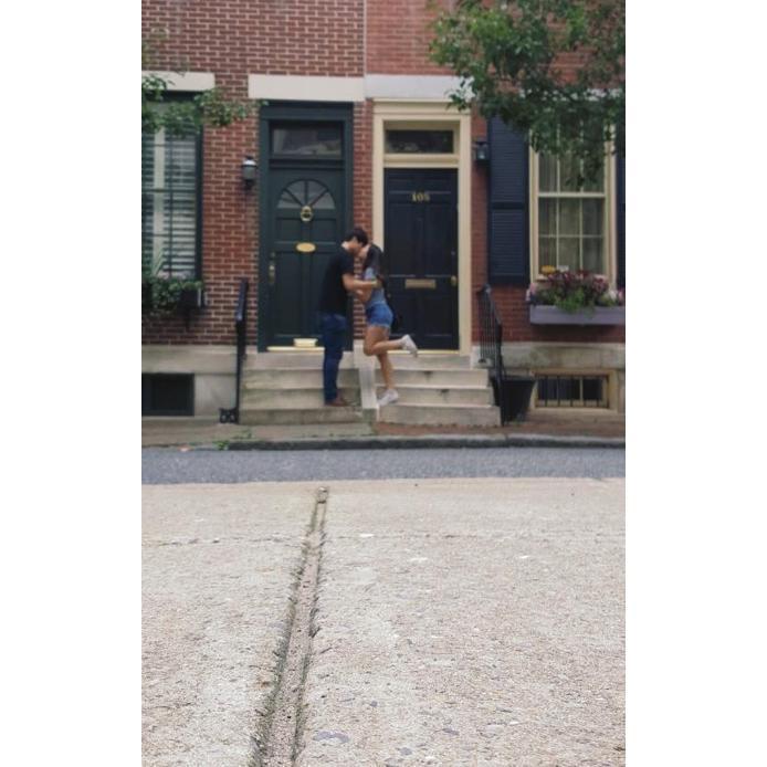 Taking in pictures in front of strangers houses.