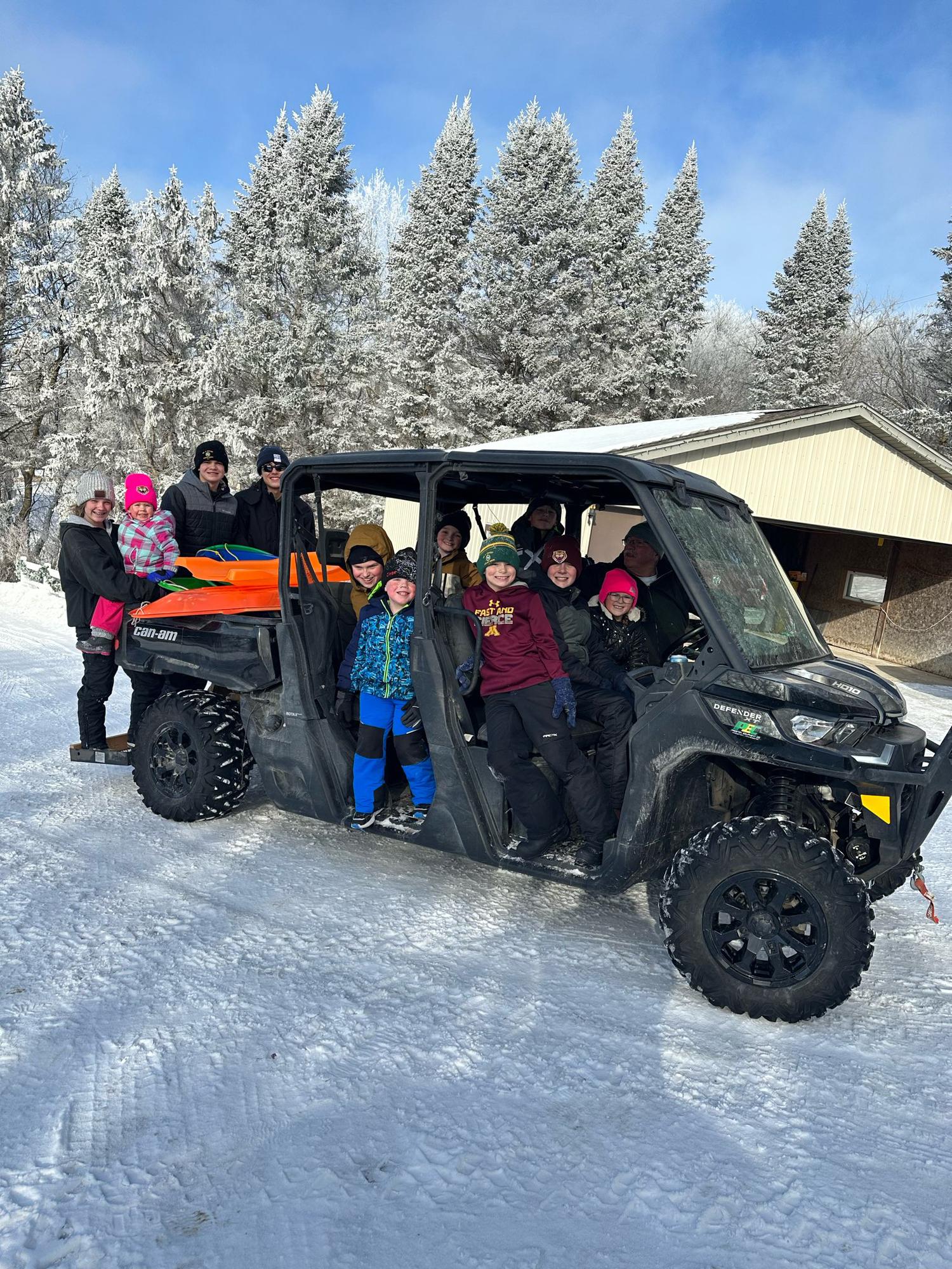 The cousins enjoy sledding the morning after the Johnson Christmas