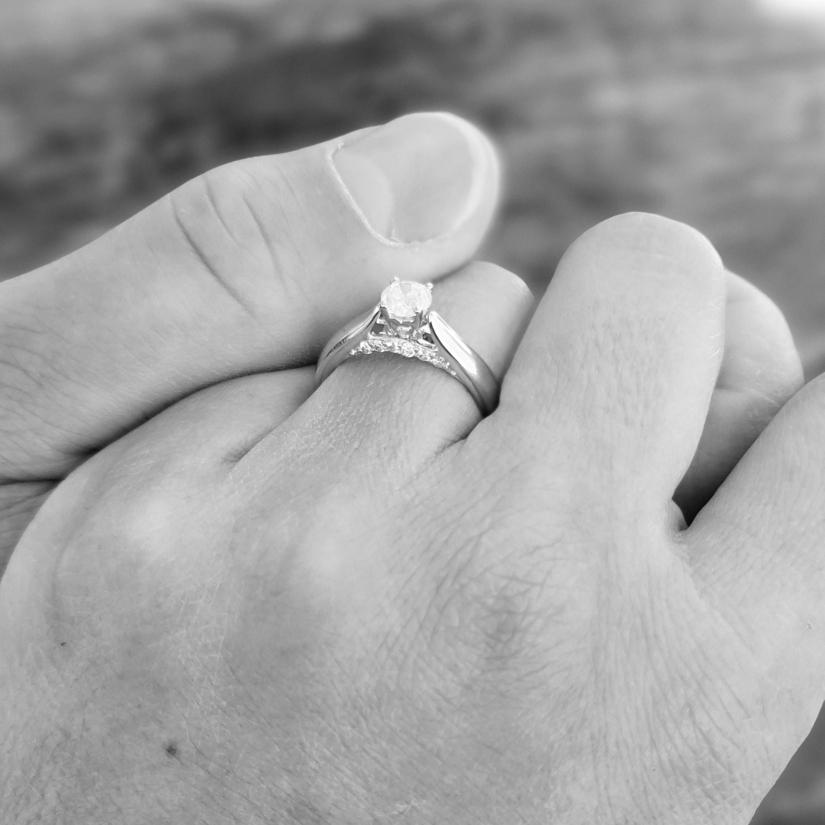 When he proposed, he explained that the six diamonds on each side were our individual perceptions of our family. The "rock" in the middle symbolizes all of us united as one.