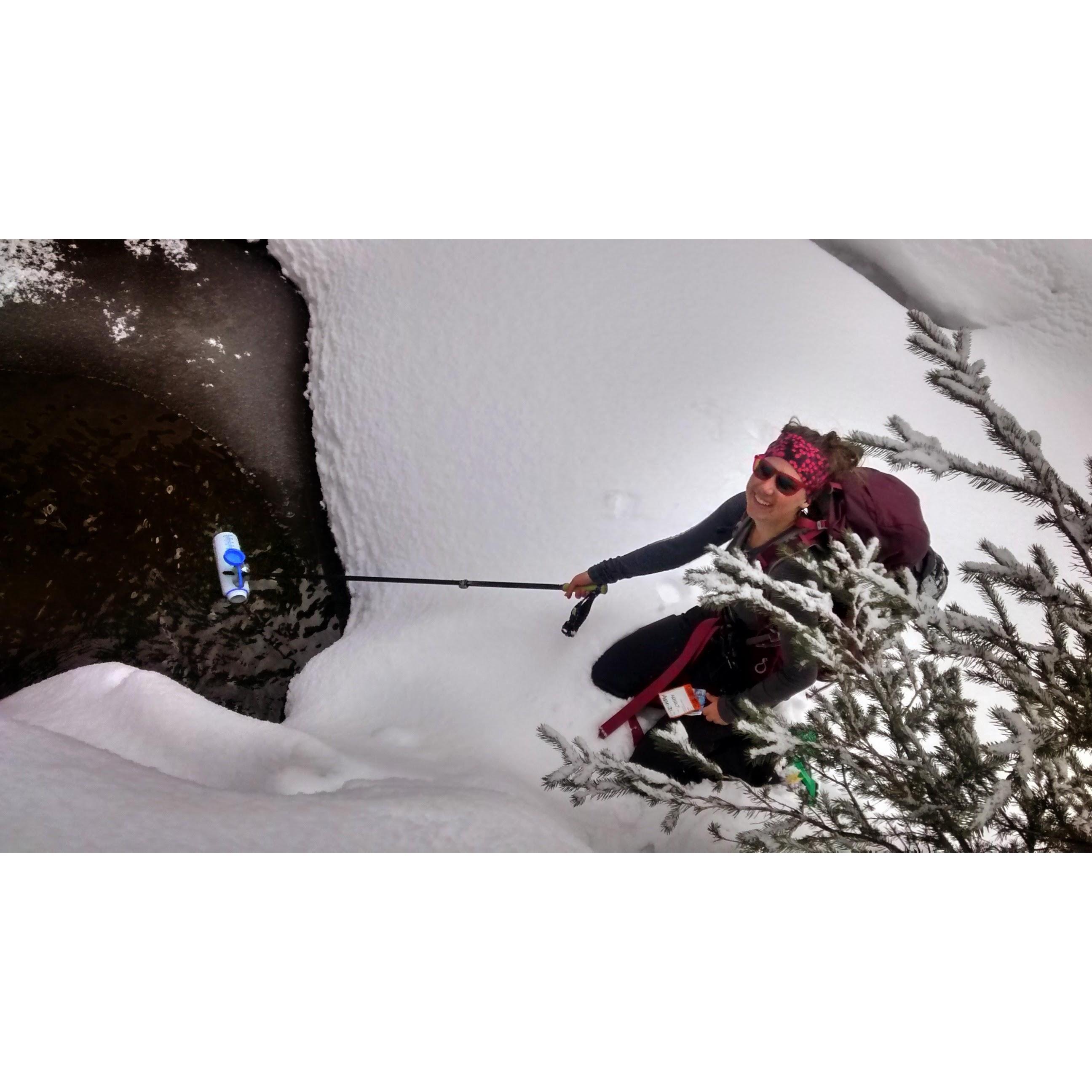 Ryanne getting freshwater during our stay at the beaver creek cabin for our first Valentine's Day together in 2015.
