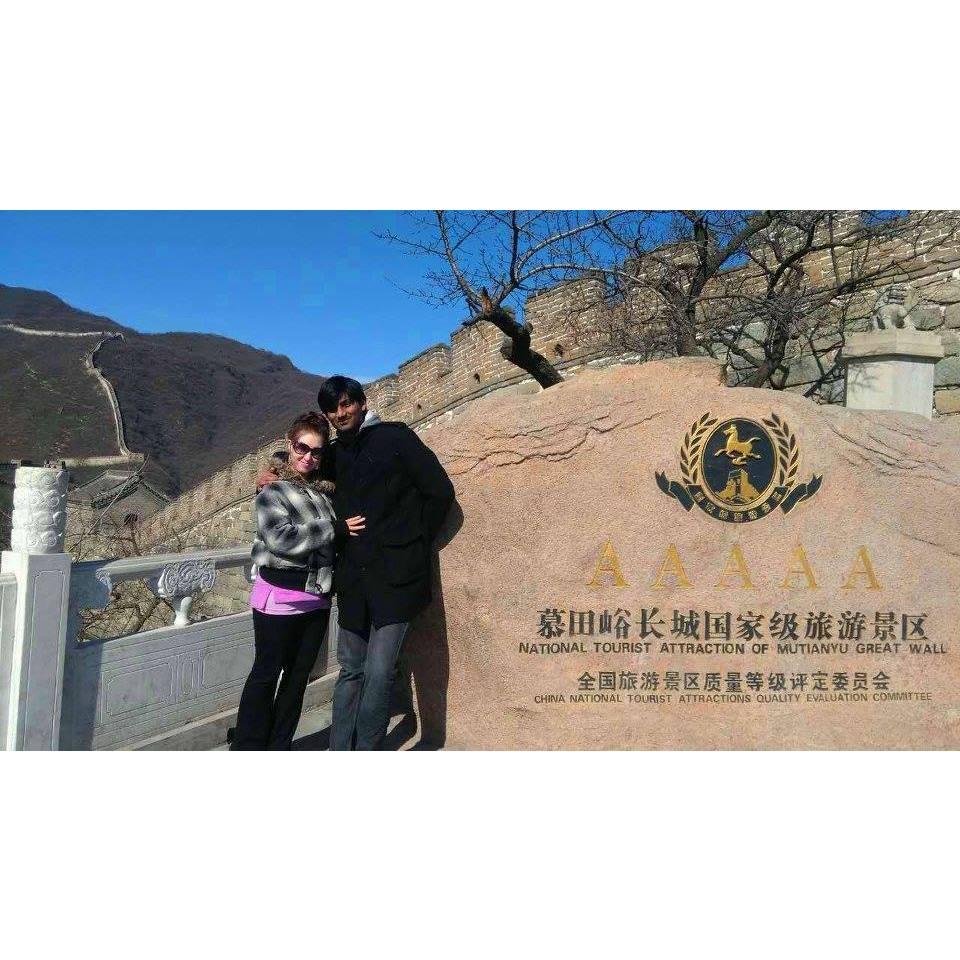 Raj and I on our first trip to the Great Wall together in 2016.  We took a picture next to that same rock in 2022