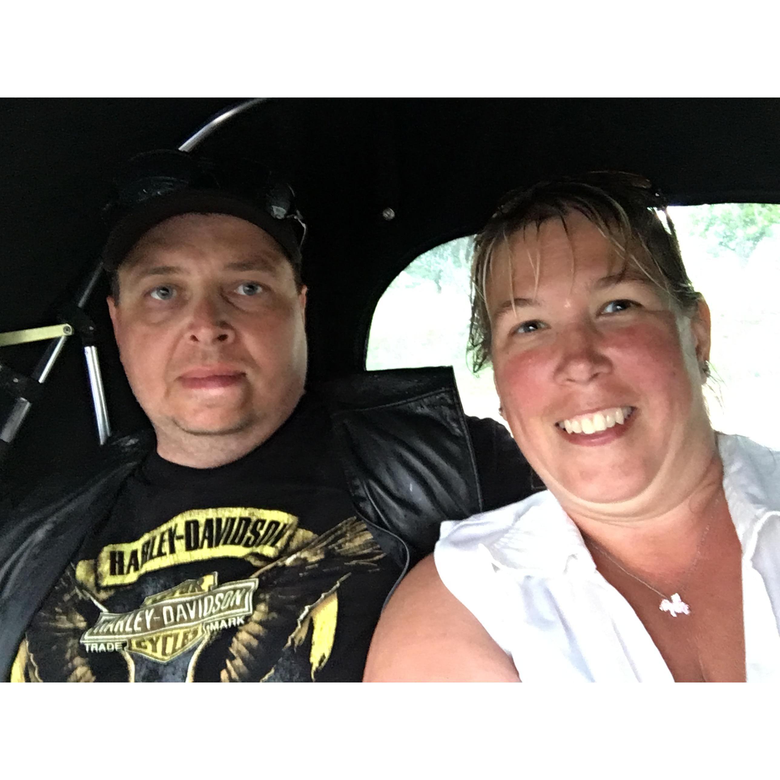 Riding the rickshaw to stay out of the rain.