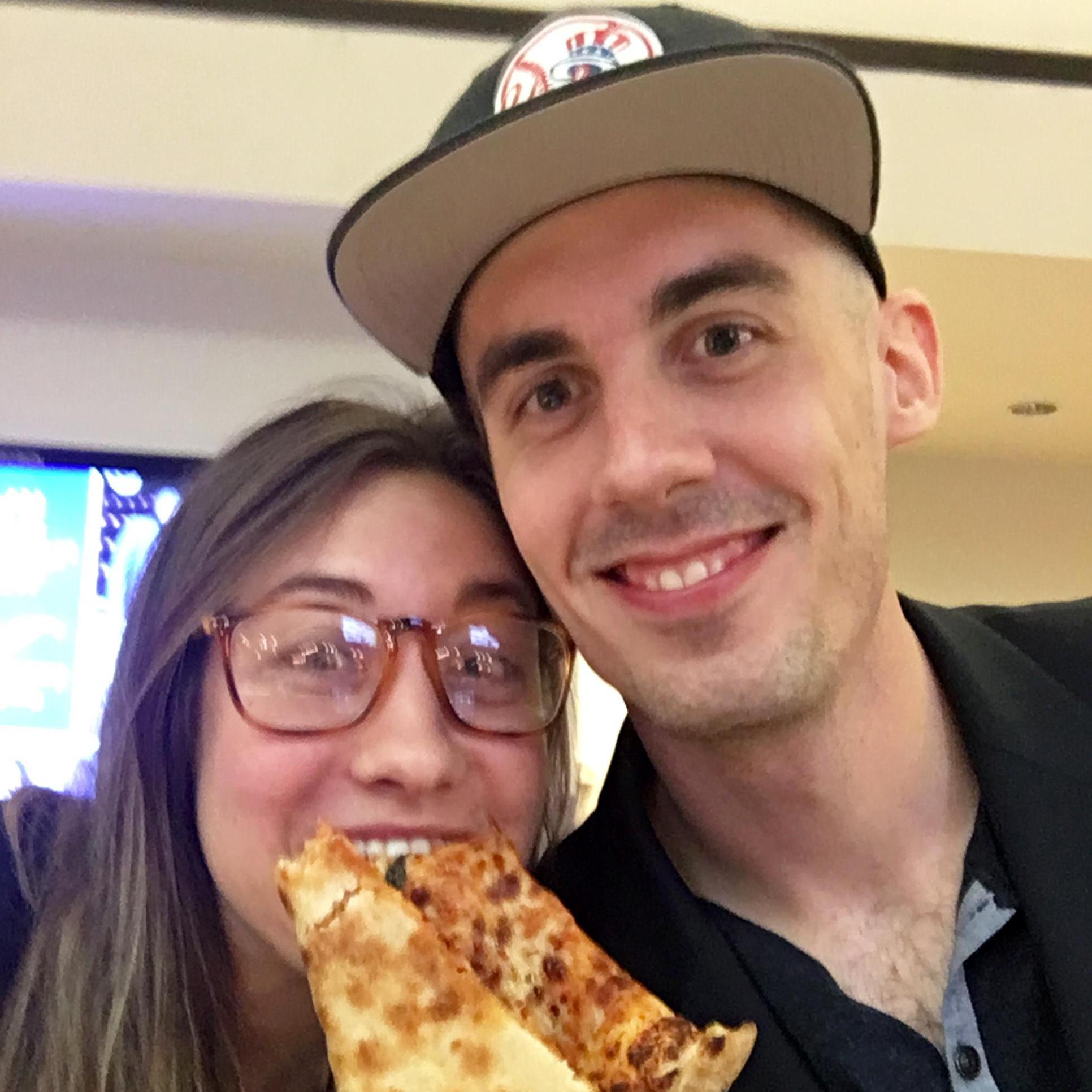 A southern girl eating Yankee pizza. Rob's dream come true!