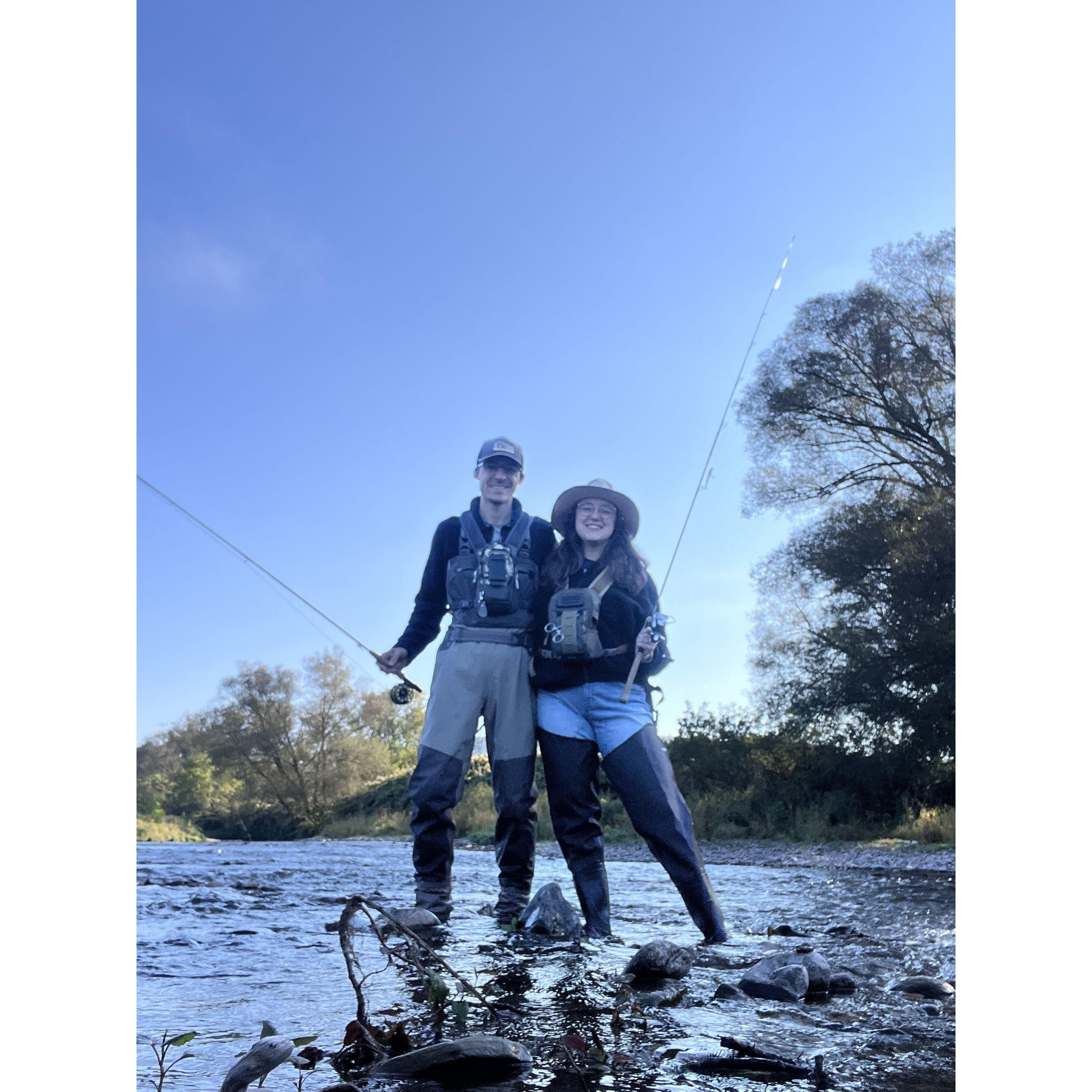 John and Lydia out on the stream catching trout and being silly