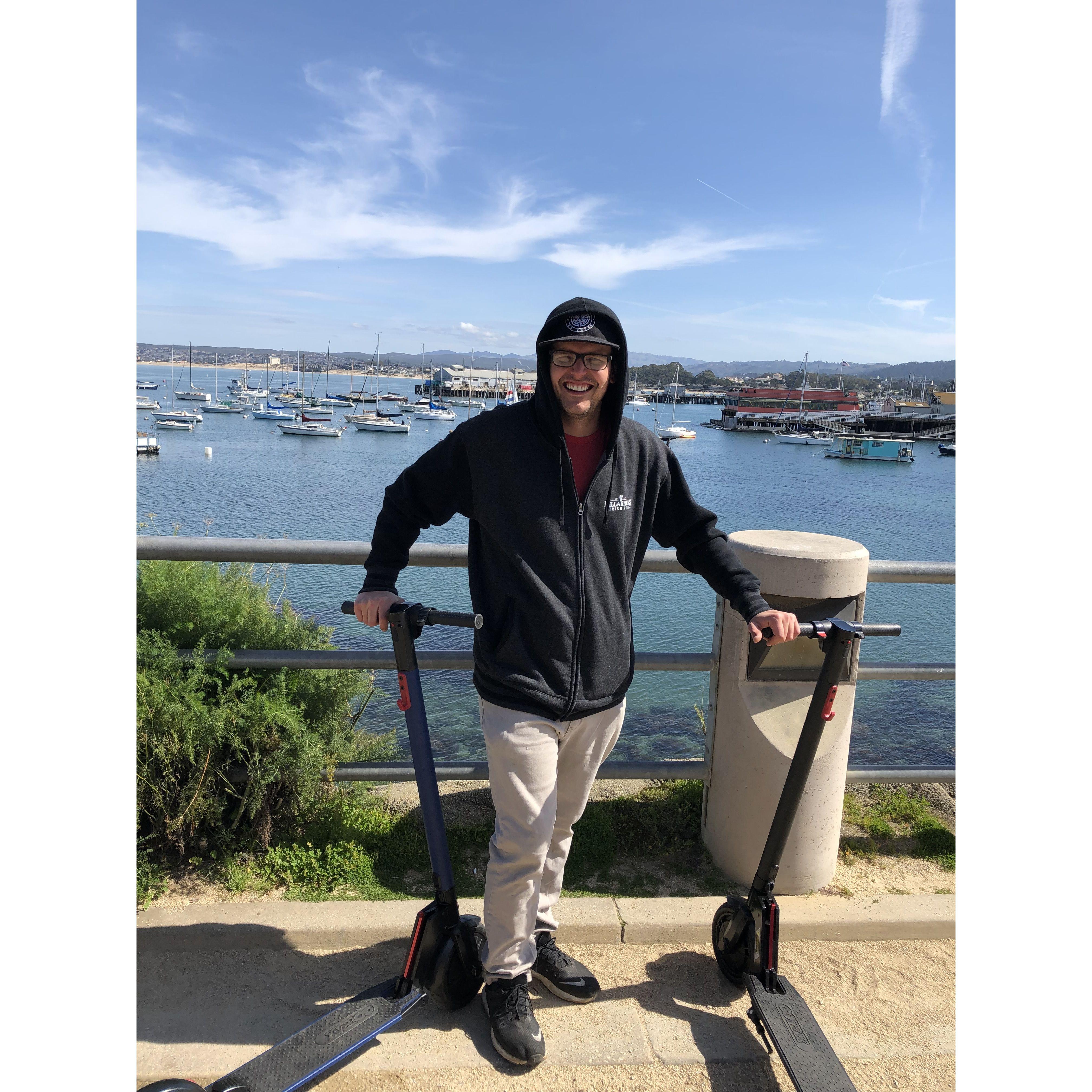 Riding around Monterey with our electric scooters from our garage!