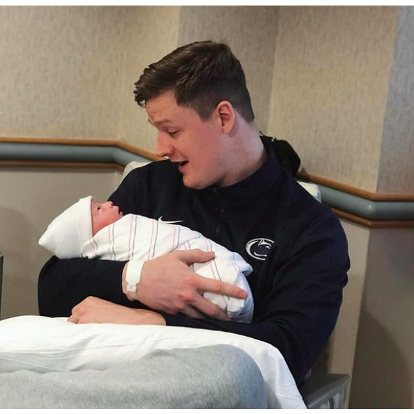 Christian holding Huddy for the first time