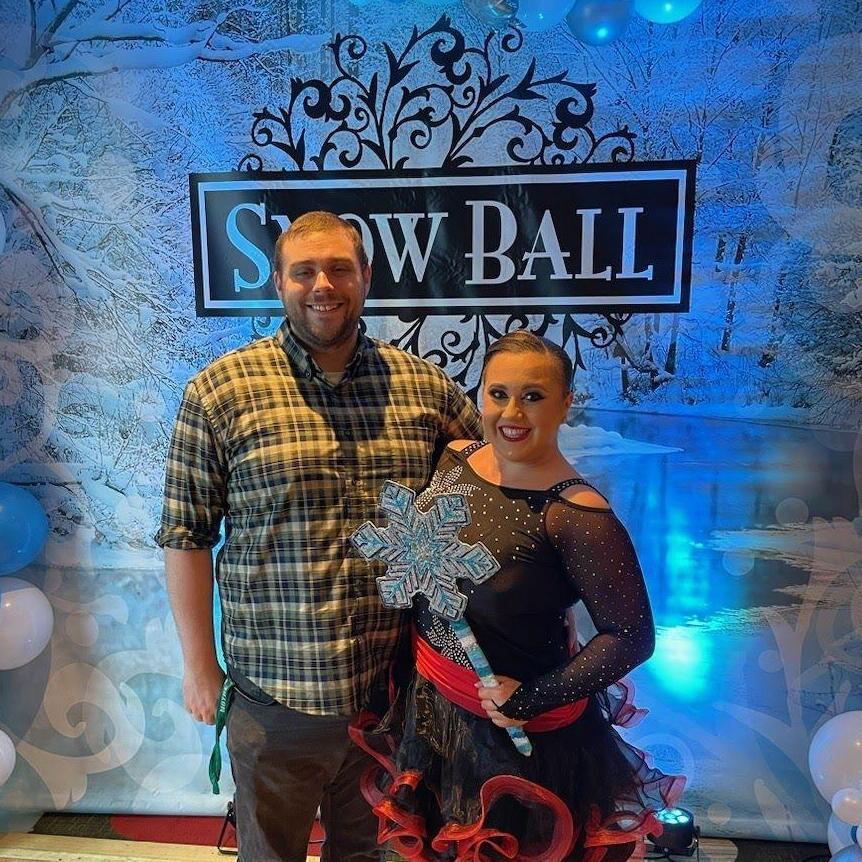 Alt Text: Maeghan and Keiran at her ballroom dancing competition in MN, the Snow Ball, in January 2023