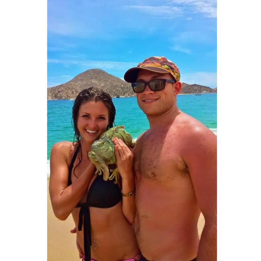 Ryan & Brit meet a new friend on the beach in Cabo , Mexico.