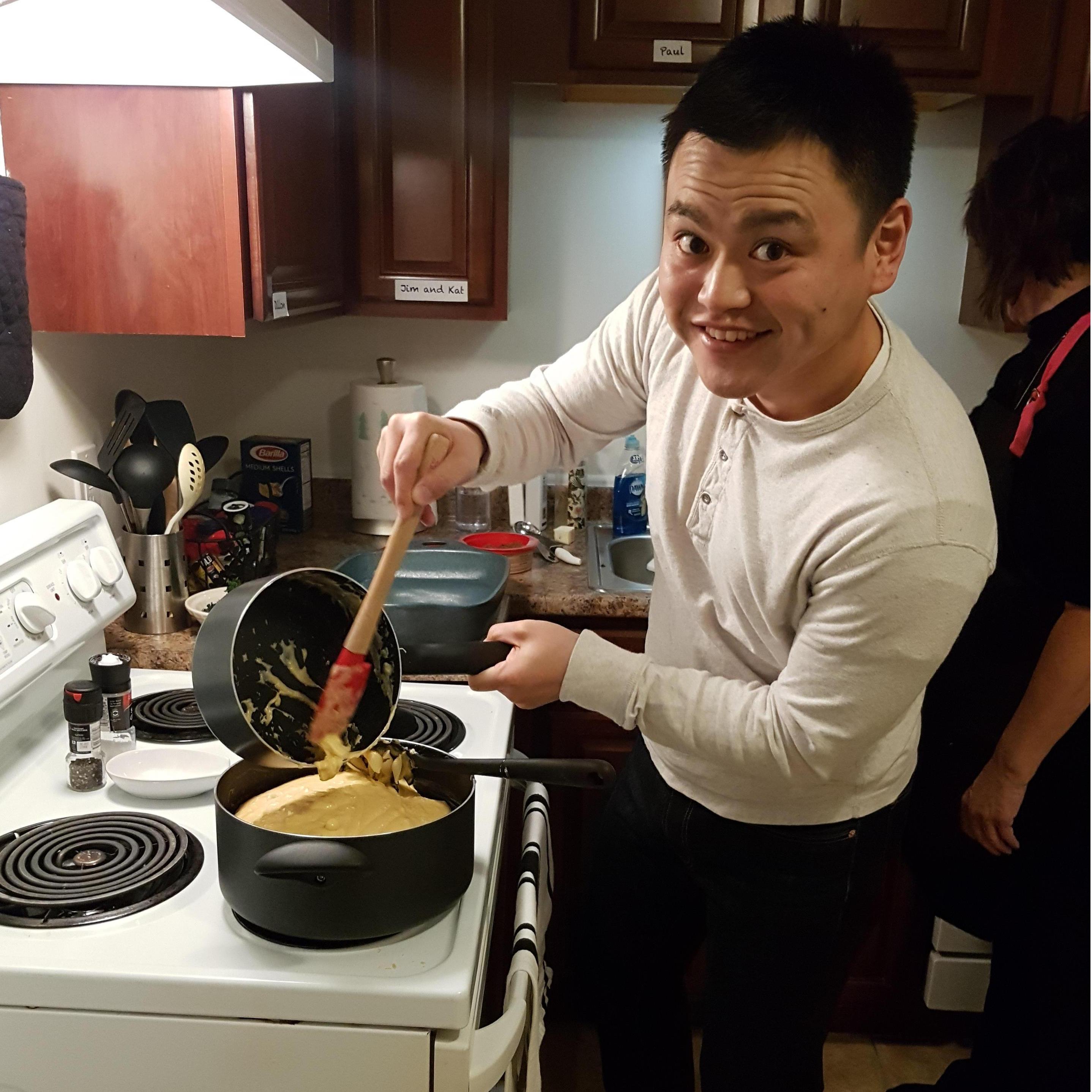Mom teaching Yuya how to make mac and cheese from scratch