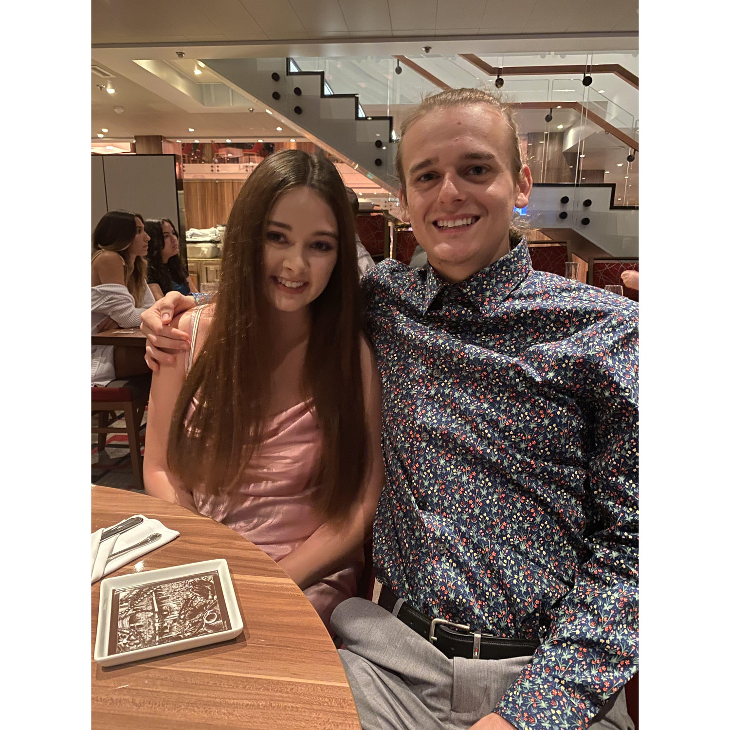 AT DINNER ON OUR CRUISE TOGETHER WITH OUR FAMILY, THE WEEK WE GOT ENGAGED IN THE BAHAMAS