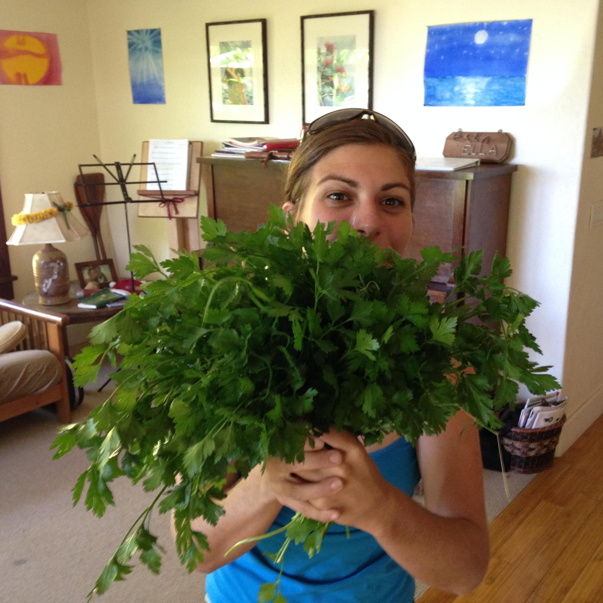 That is me peeking behind a bouquet of parsley, harvested from our garden!