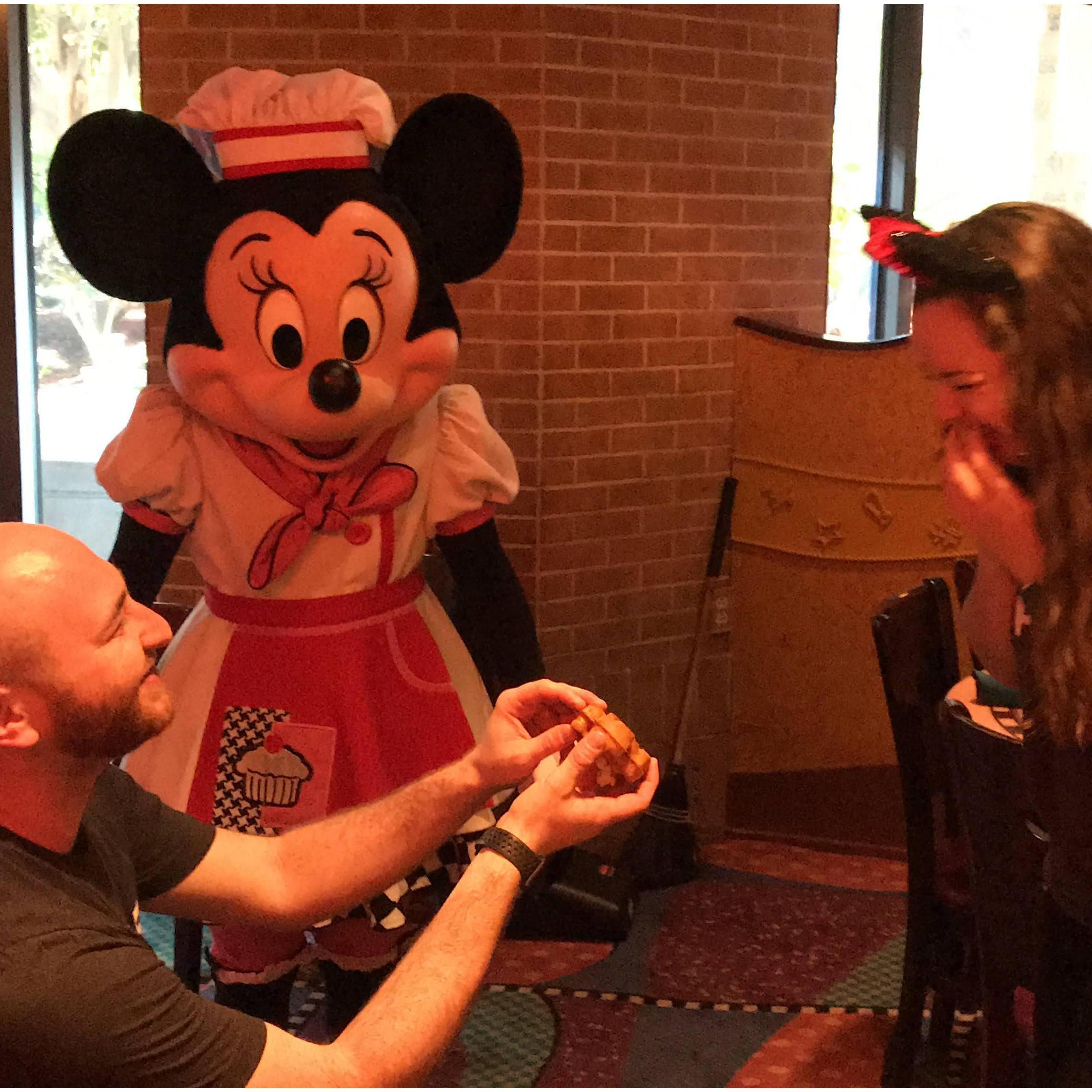 (he's "proposing" with a mickey waffle)