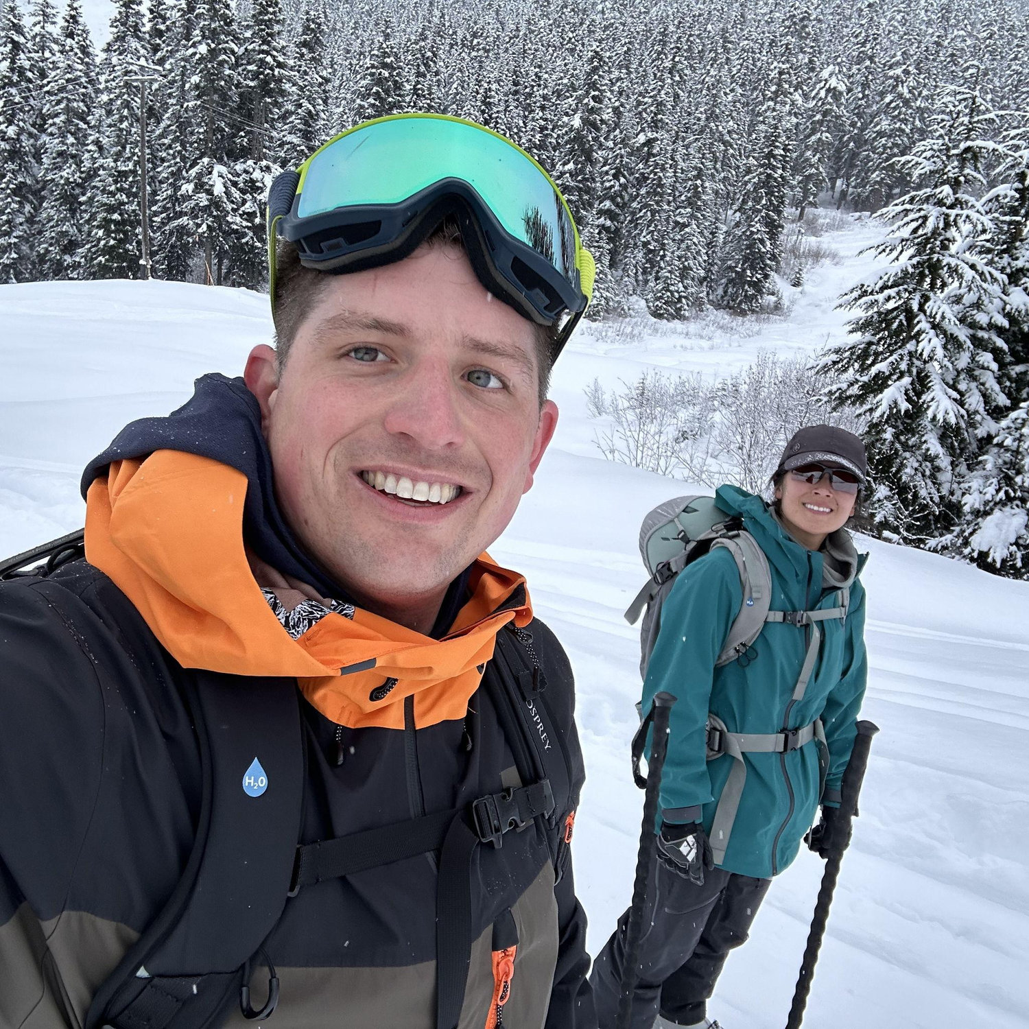 Marcie teaching AJ how to ski in the backcountry.