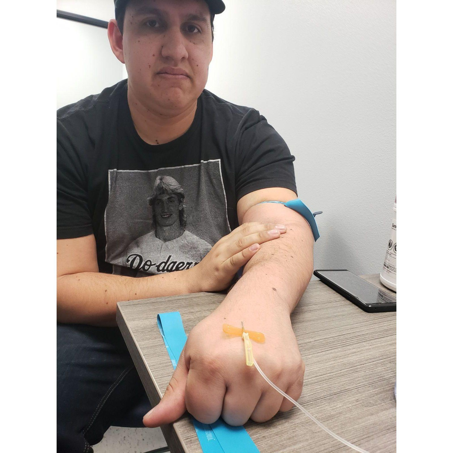 Zach was kind enough to allow Ginger to practice IVs while in nursing school