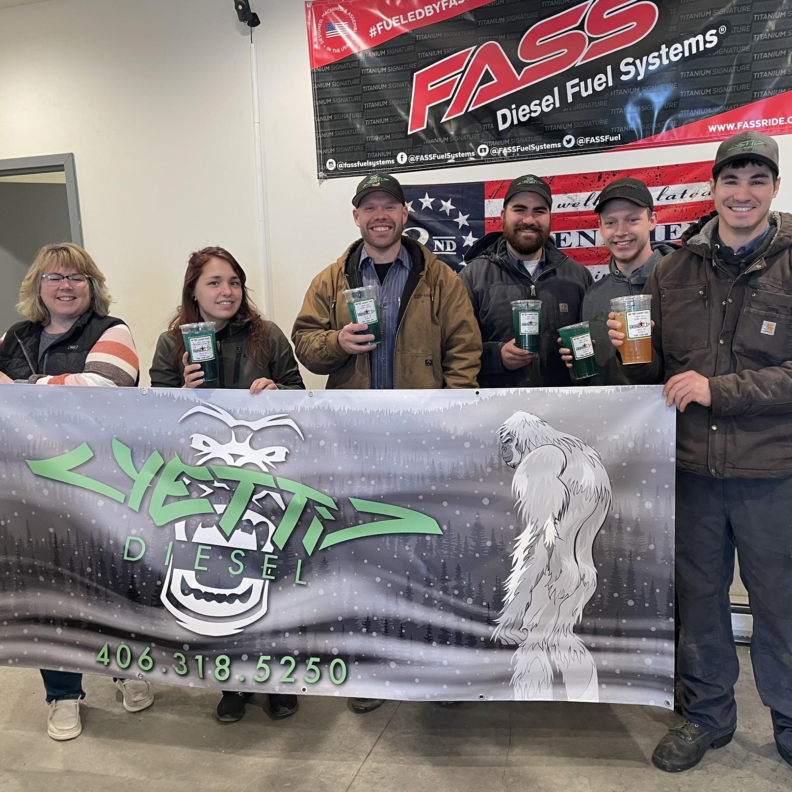 Erik with his work crew and his favorite drink in hand!