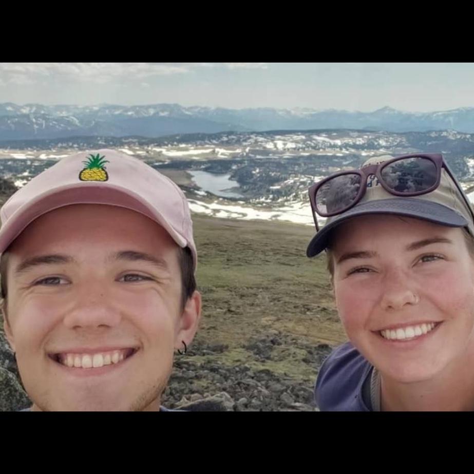 On top of a mountain on a road trip in 2021, 6 months before we started dating.