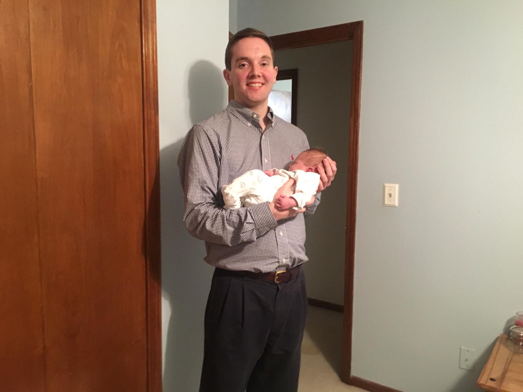 Trevor holding our niece, Alana, for the first time.