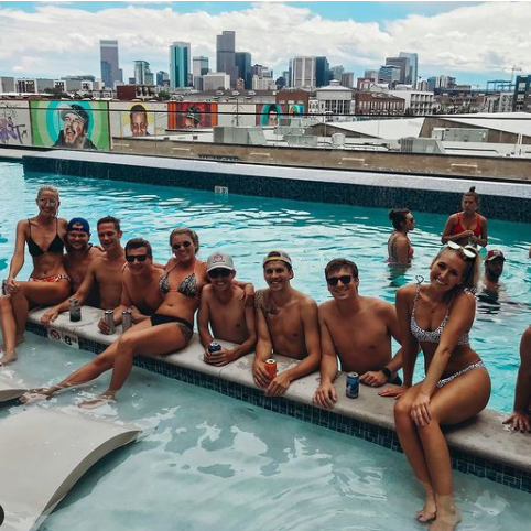 At our apartment pool with friends summer of 2019 before moving to MN. We loved the pool parties and view at the Edison.