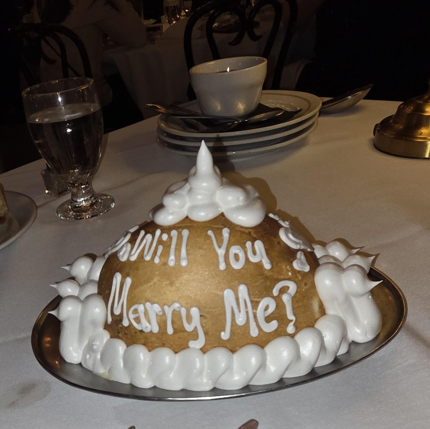 She said yes! On January 3, 2026, CC surprised Kathy with a proposal at Antoine's Restaurant in New Orleans — an intimate, joyful evening they will always remember.