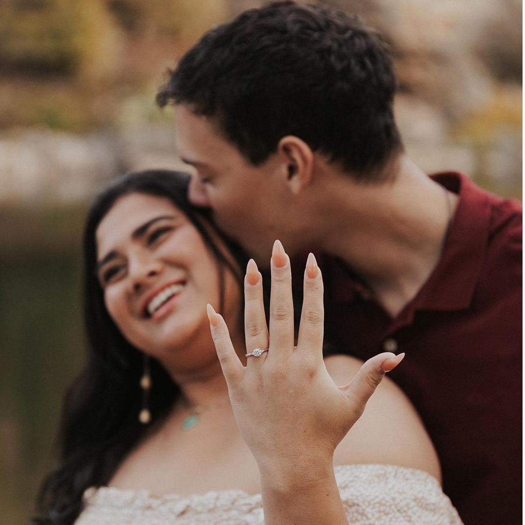 Showing off the ring, an engagement photo session must.