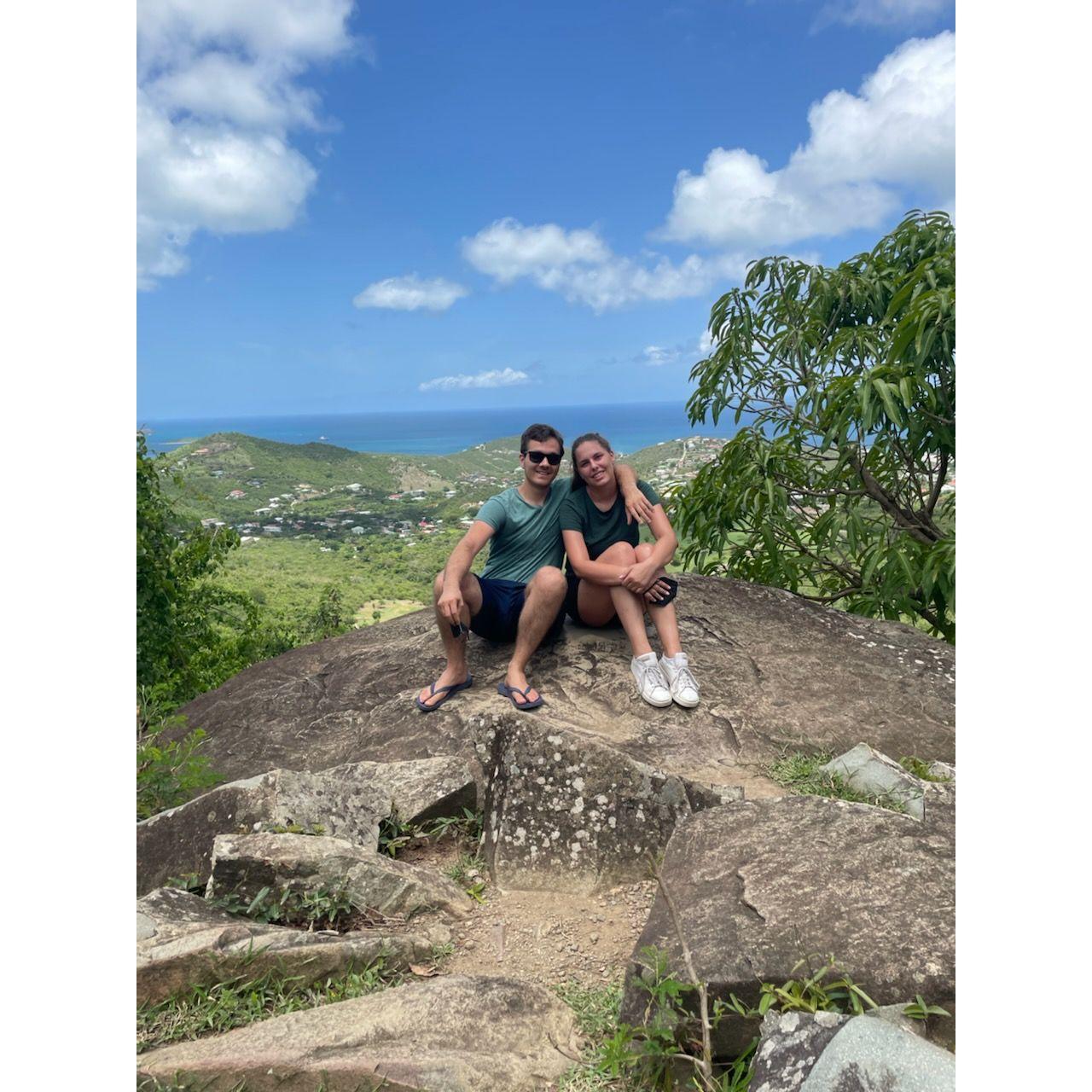 Our picture at the top of a mountain after a steep trek in St. Maarten in 2021