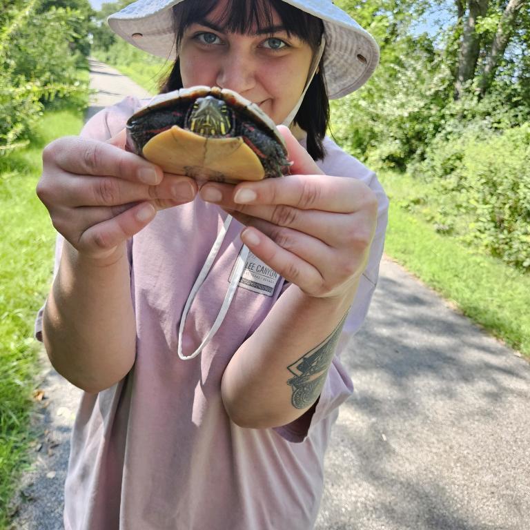 Melanie’s love for animals shining through. We found a turtle on a walk, so she moved it out of the way after a little photo op.
