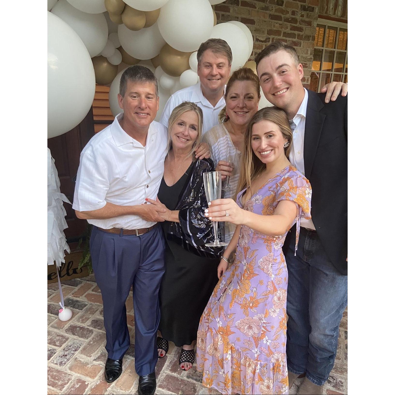 Our parents are so excited! This picture was taken at our surprise engagement party right after the proposal, hosted by the Barnes!