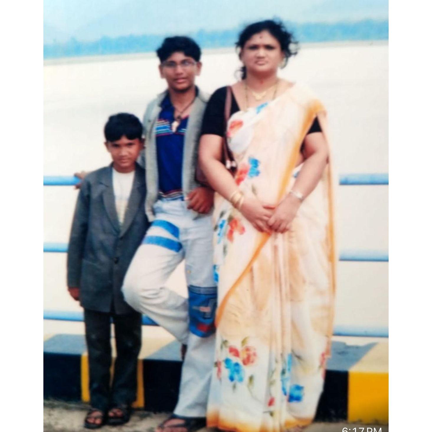 Sameer with his younger brother and mom