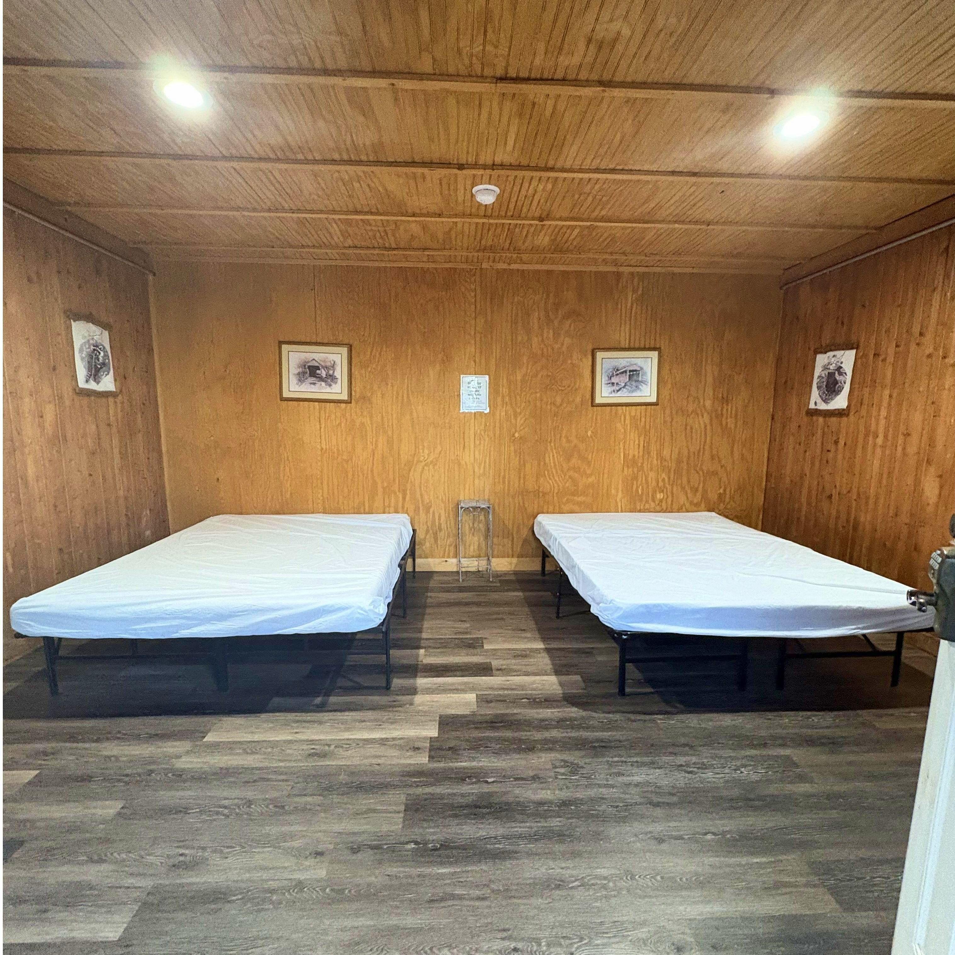 2 Bed Cabin. 2 Queen Size beds. Sleeps 4 Campers. Heating and AC in each cabin.