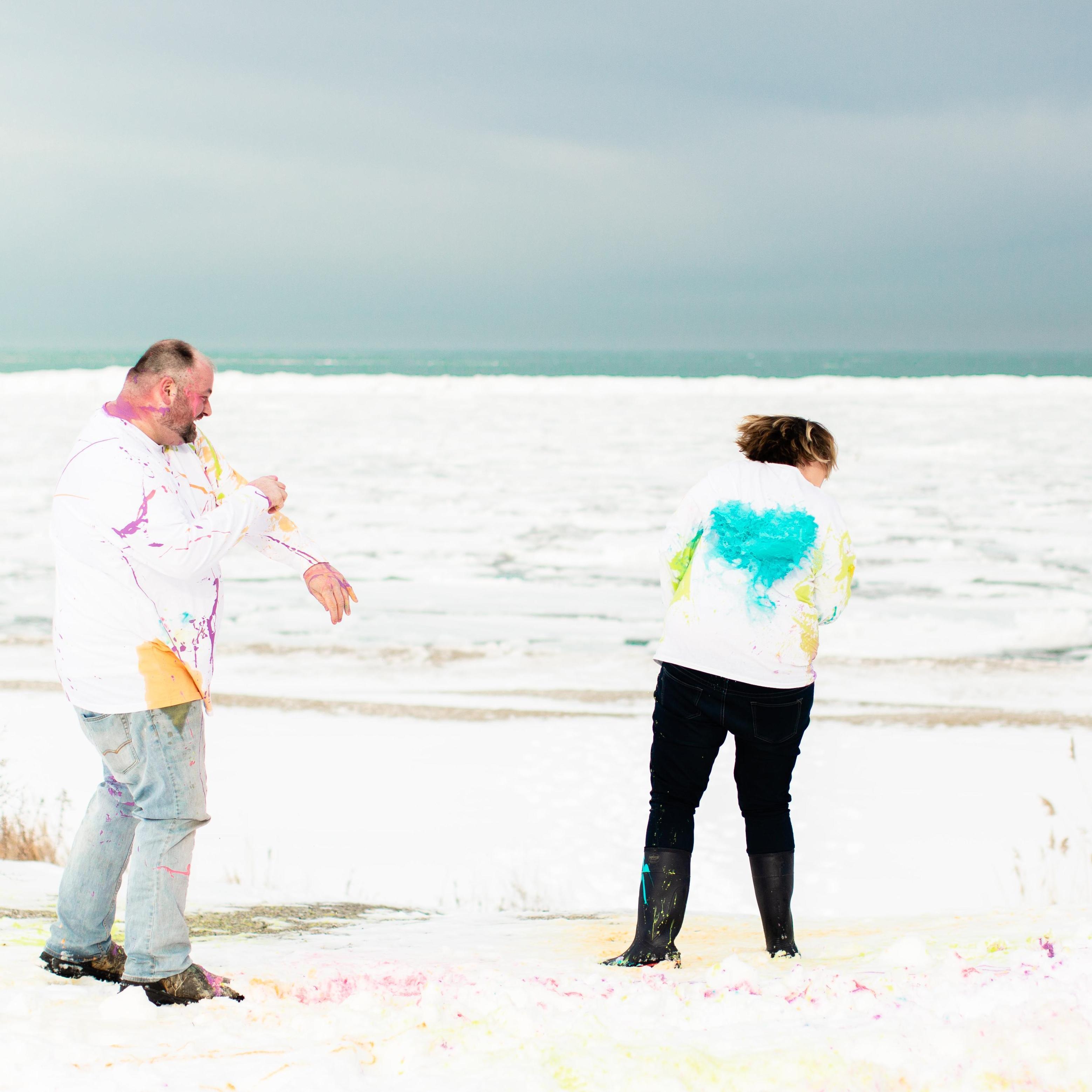 Dan's aim is so good he created a Heart on the back of Kelly's shirt