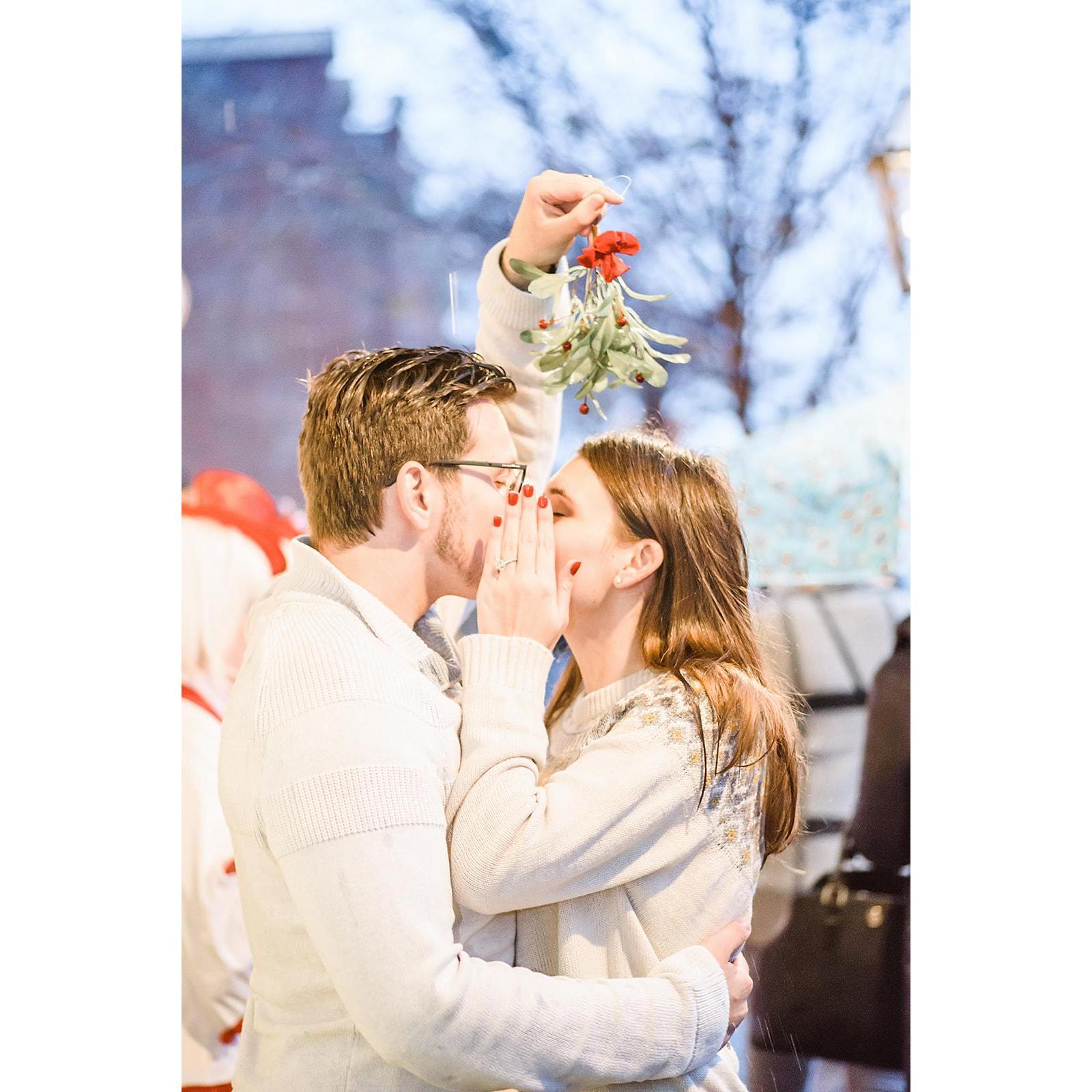 Kissing under the mistletoe.