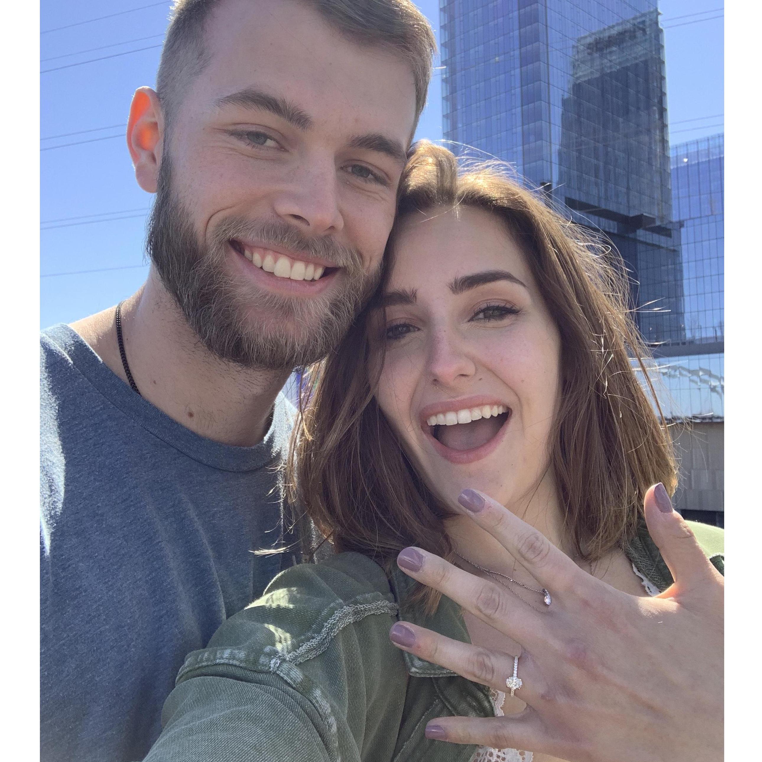 March 14, 2022 - The day Zach proposed! We spent the day downtown, and he proposed on top of the pedestrian bridge - the place we first realized we loved each other!