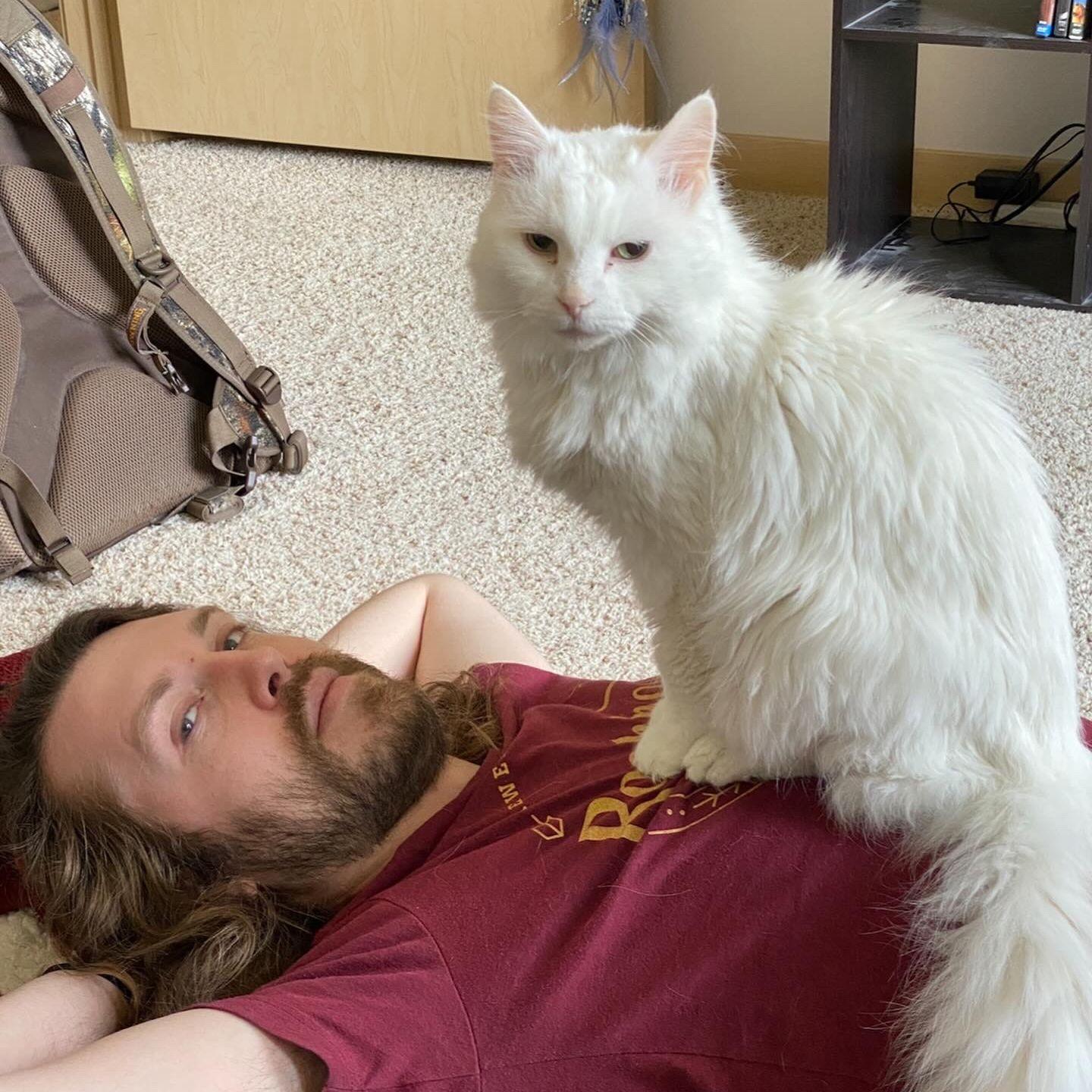 Home with Gandalf, our first cat together who passed in 2024