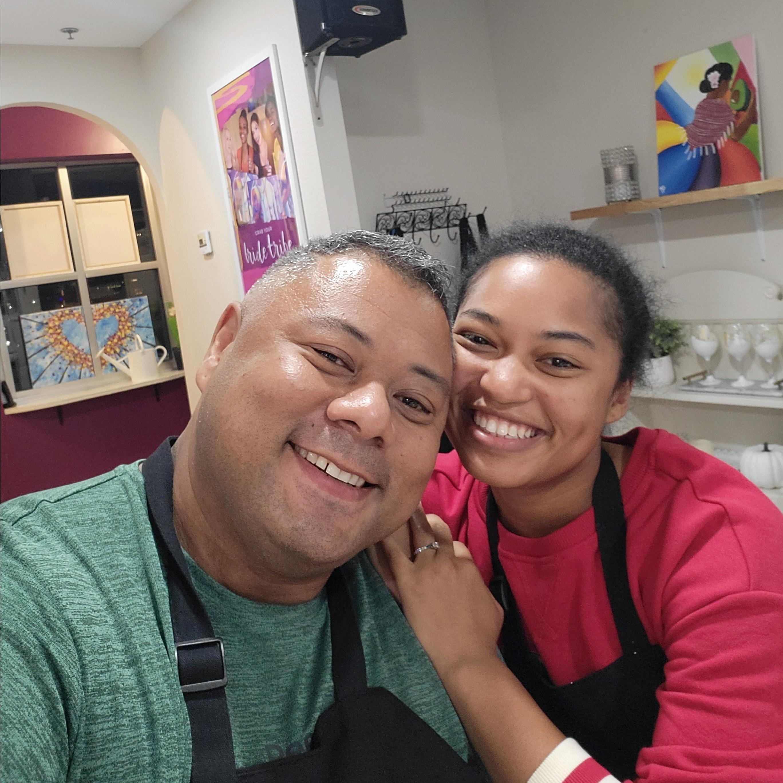 Paint, wine, and matching aprons.