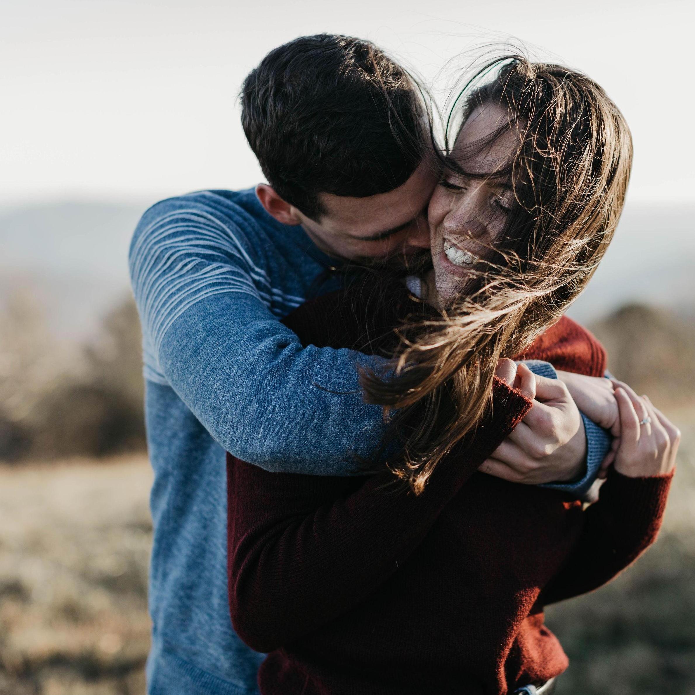 Daniel and Sarah snuggled up during their engagement photos, trying to stay warm despite the cold November wind!