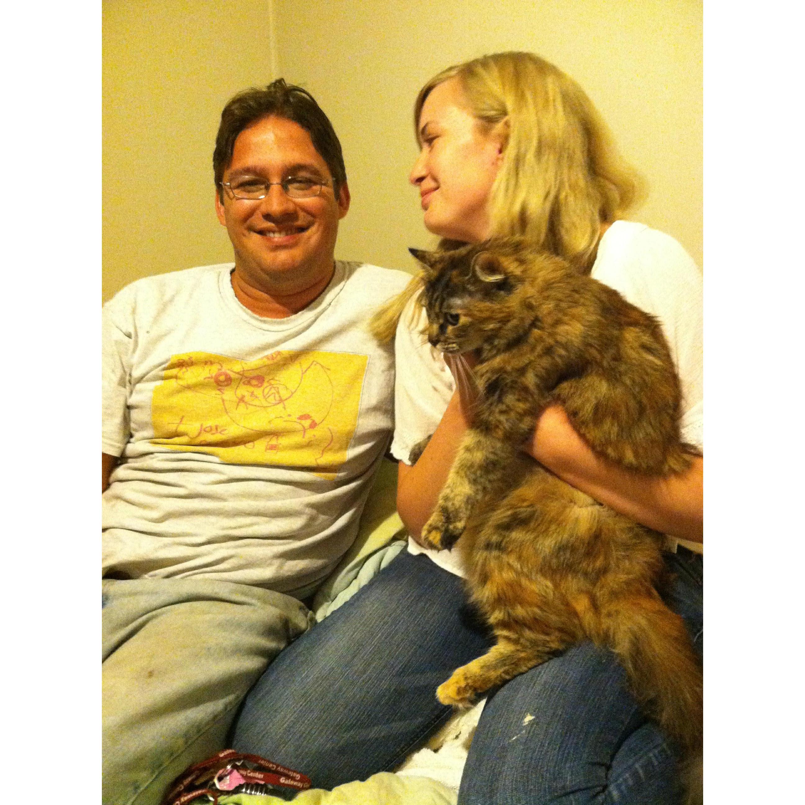 Holding kitten, and wearing a shirt Lia made him.